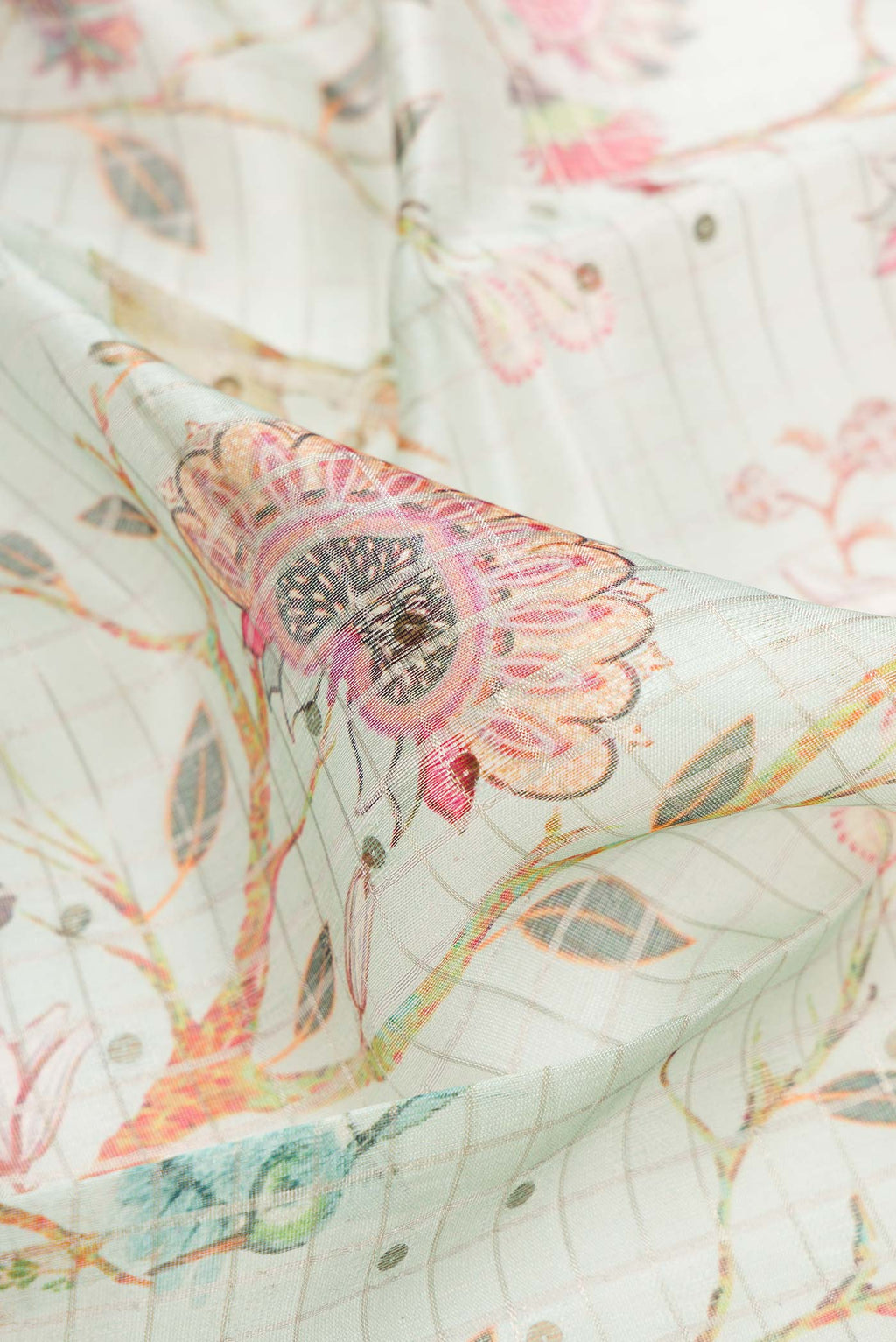 Close up of Sea Green Dual Tone Tussar Silk Saree with Printed design on the body and Zari Border.  displaying folds