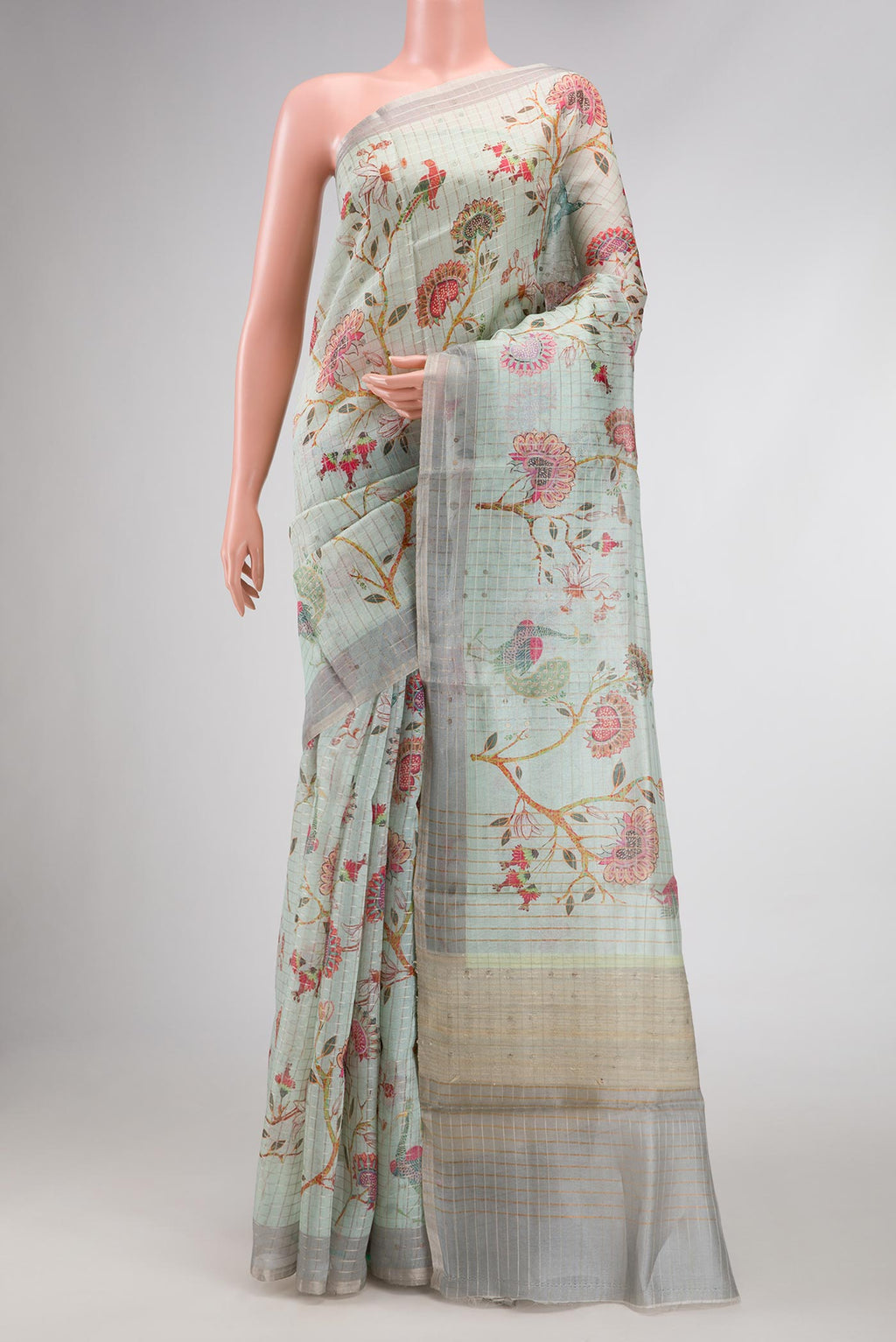 Sea Green Dual Tone Tussar Silk Saree with Printed design on the body and Zari Border.  displayed on a mannequin