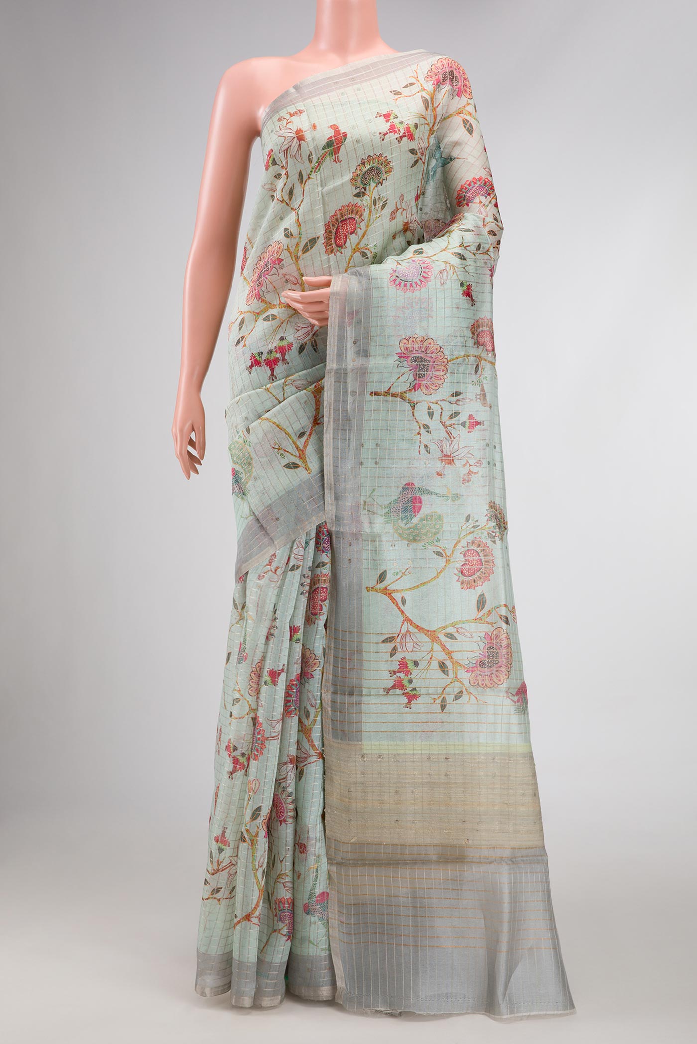 Sea Green Dual Tone Tussar Silk Saree with Printed design on the body and Zari Border.  displayed on a mannequin