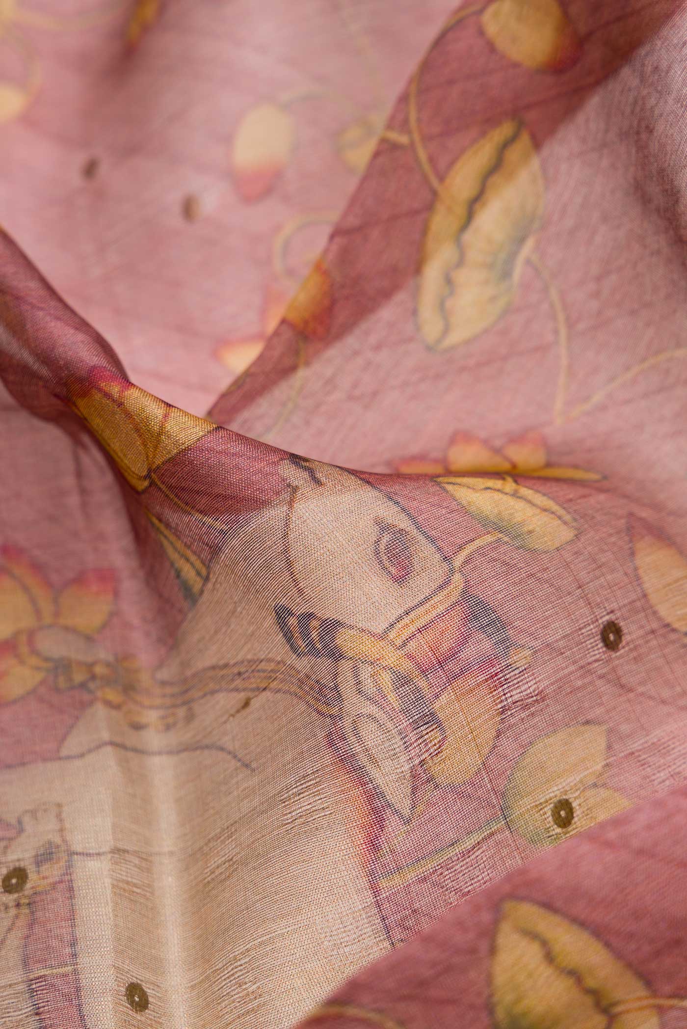 Close up of Pink Dual Tone Tussar Silk Saree with Printed design on the body and Zari Border.  displaying folds