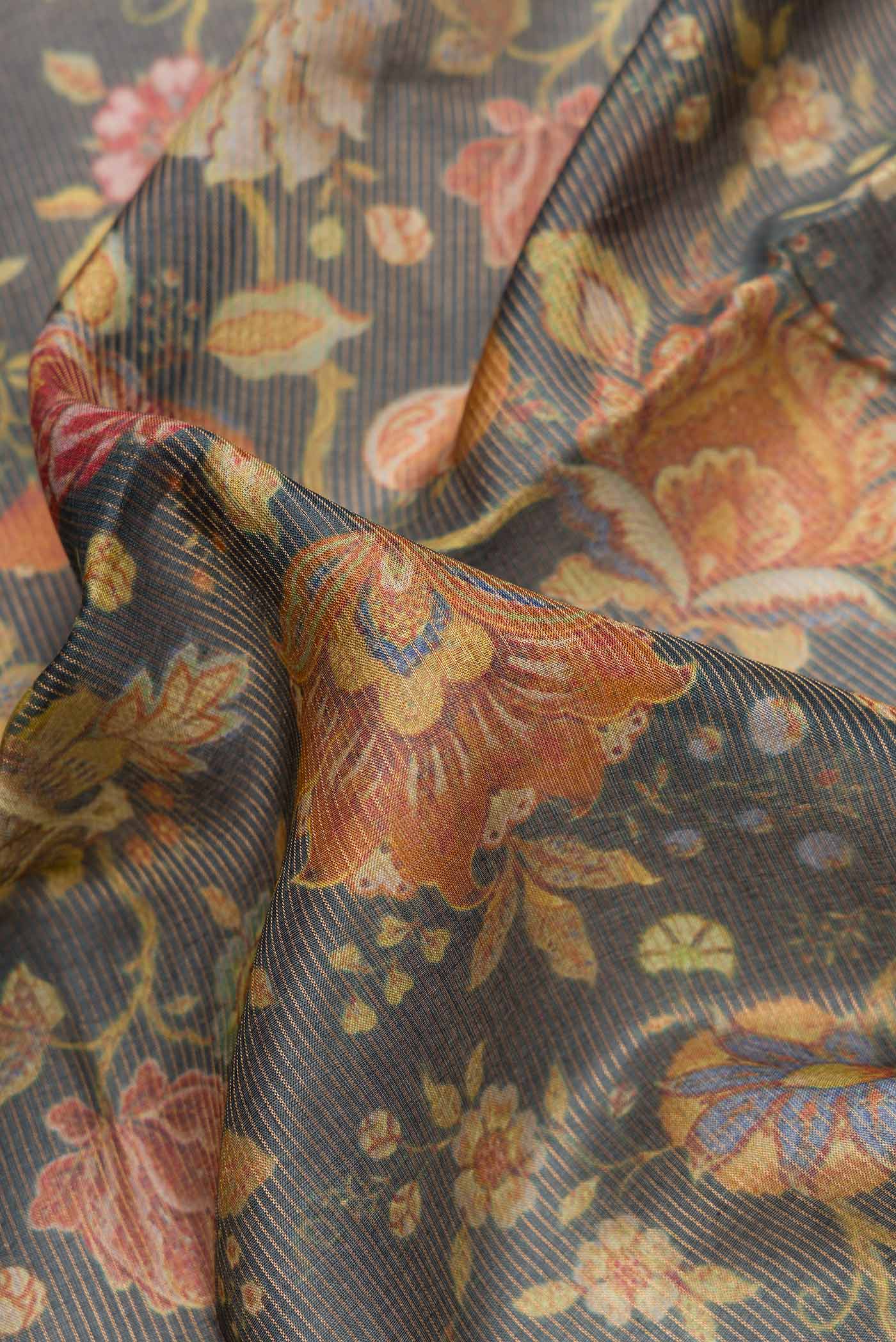 Close up of Navy Blue Dual Tone Tussar Silk Saree with Printed design on the body and Zari Border.  displaying folds