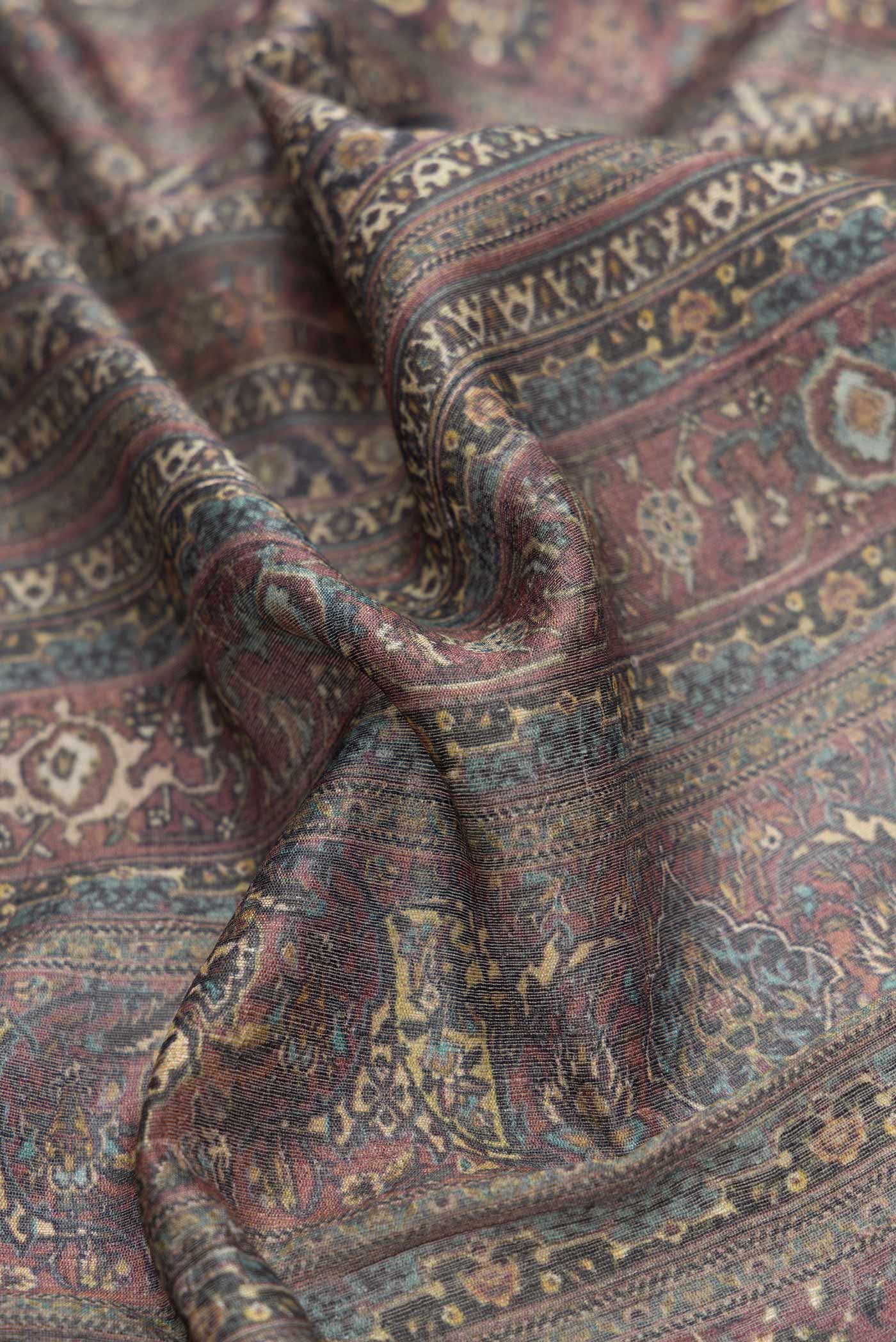 Close up of Grey Dual Tone Tussar Silk Saree with Printed design on the body and Zari Border.  displaying folds