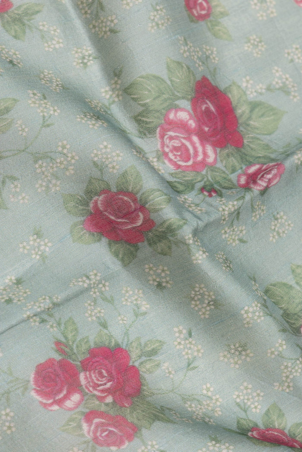 Close up of Green Dual Tone Tussar Silk Saree with Printed design on the body and Zari Border.  displaying folds