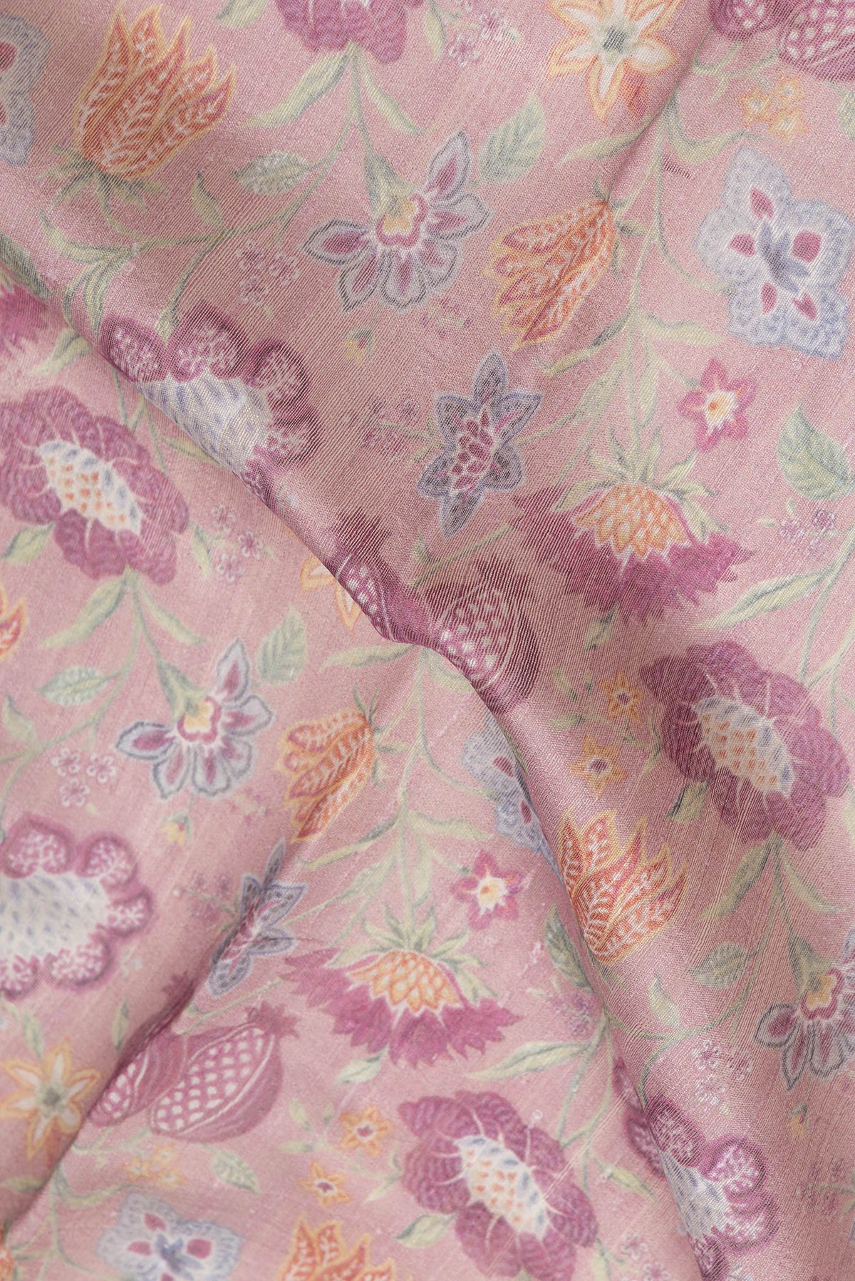 Close up of Pink Dual Tone Tussar Silk Saree with Printed design on the body and Zari Border.  displaying folds