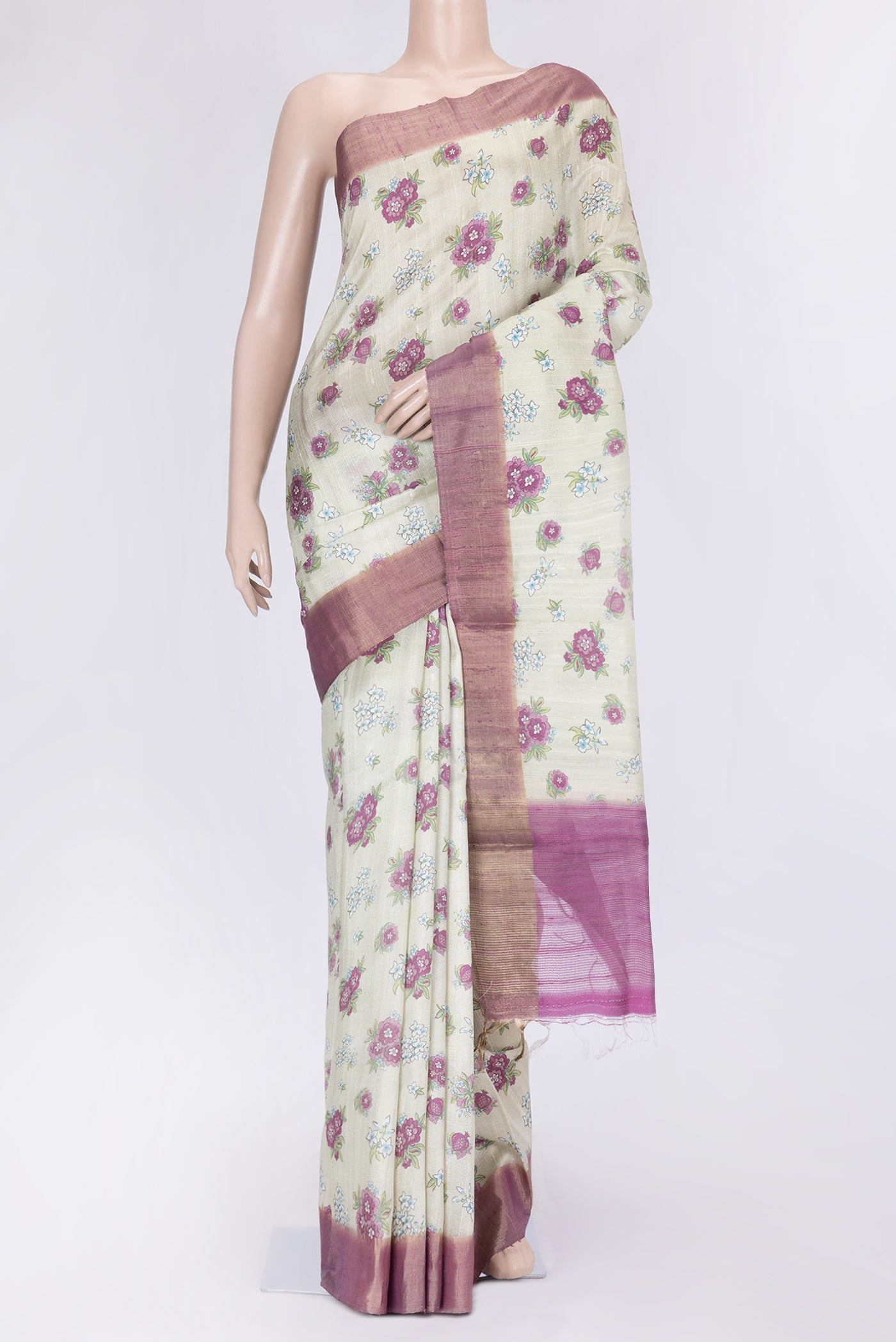 Pista Green Dual Tone Tussar Silk Saree with Printed design on the body and Zari Border.  displayed on a mannequin