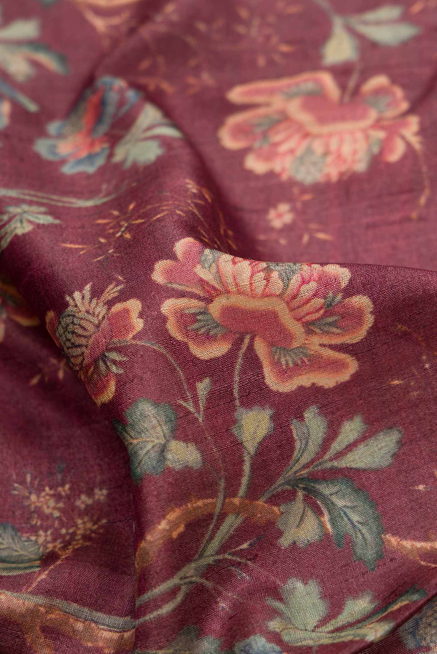 Close up of Brown Dual Tone Tussar Silk Saree with Printed design on the body and Zari Border.  displaying folds