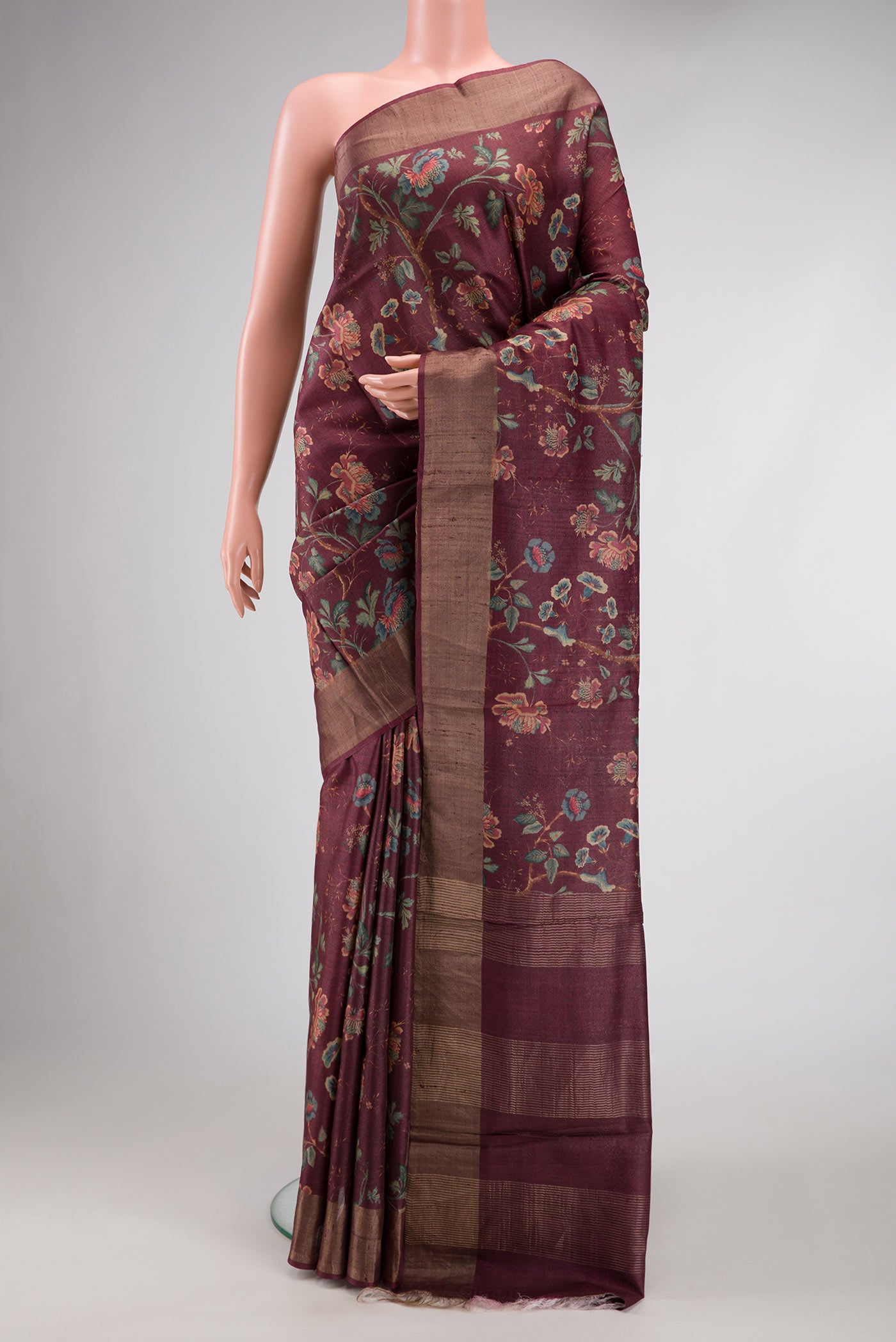 Brown Dual Tone Tussar Silk Saree with Printed design on the body and Zari Border.  displayed on a mannequin