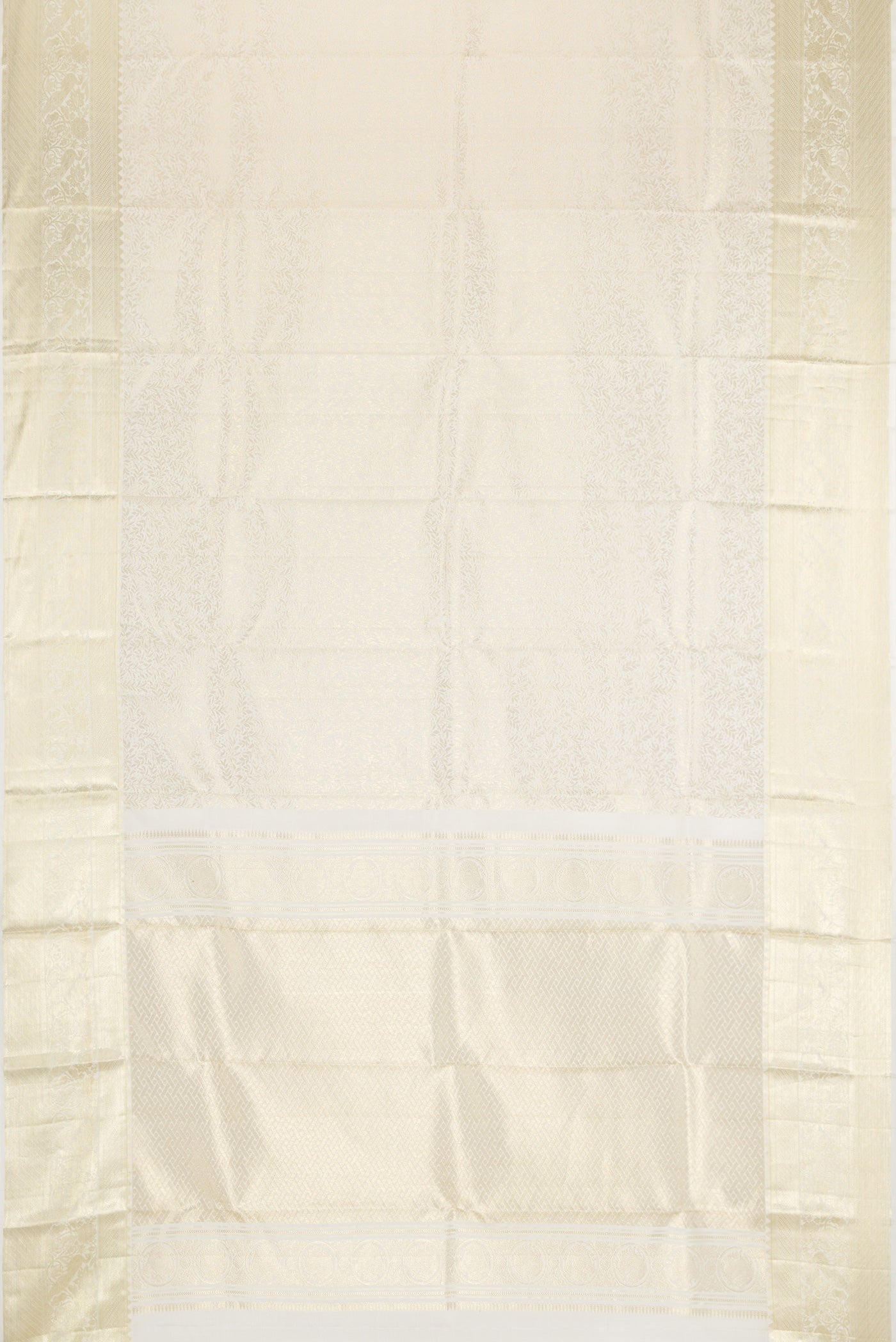 Flat view of Off White Kanchipuram Silk Saree with Zari Brocade on the body and Zari Border. 