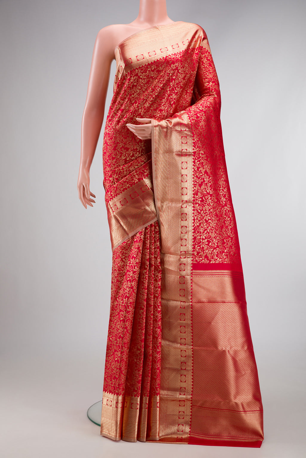 Red Dual Tone Kanchipuram Silk Saree with Zari Brocade on the body and Zari Border.  displayed on a mannequin