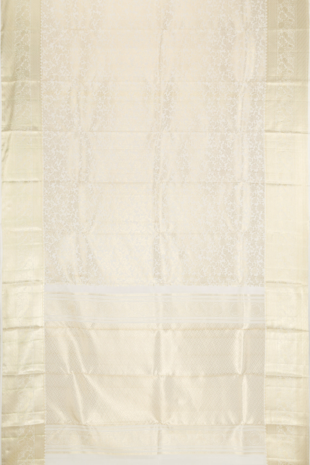 Flat view of Off White Kanchipuram Silk Saree with Zari Brocade on the body and Zari Border. 