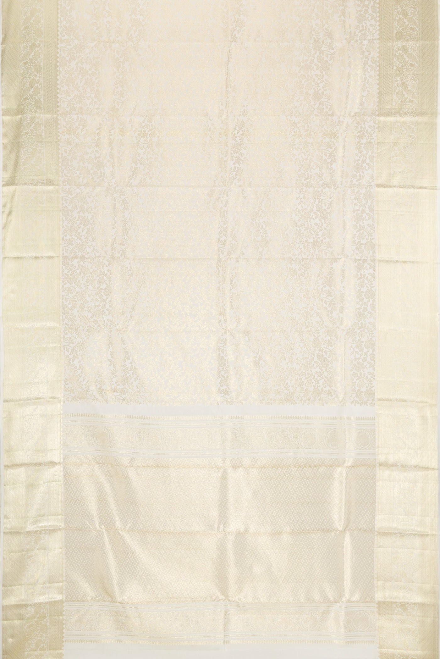 Flat view of Off White Kanchipuram Silk Saree with Zari Brocade on the body and Zari Border. 