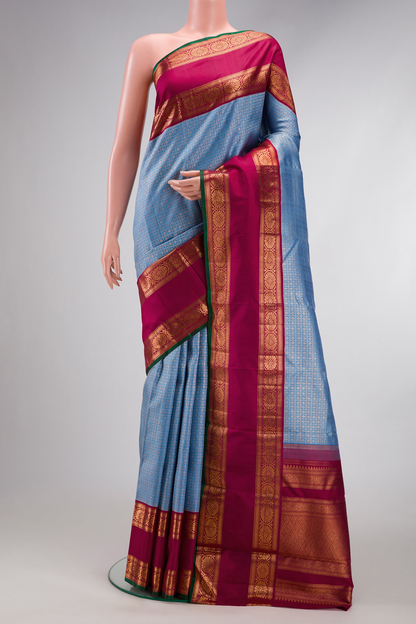 Light Blue Dual Tone Kanchipuram Silk Saree with Zari Brocade on the body and Zari Border.  displayed on a mannequin
