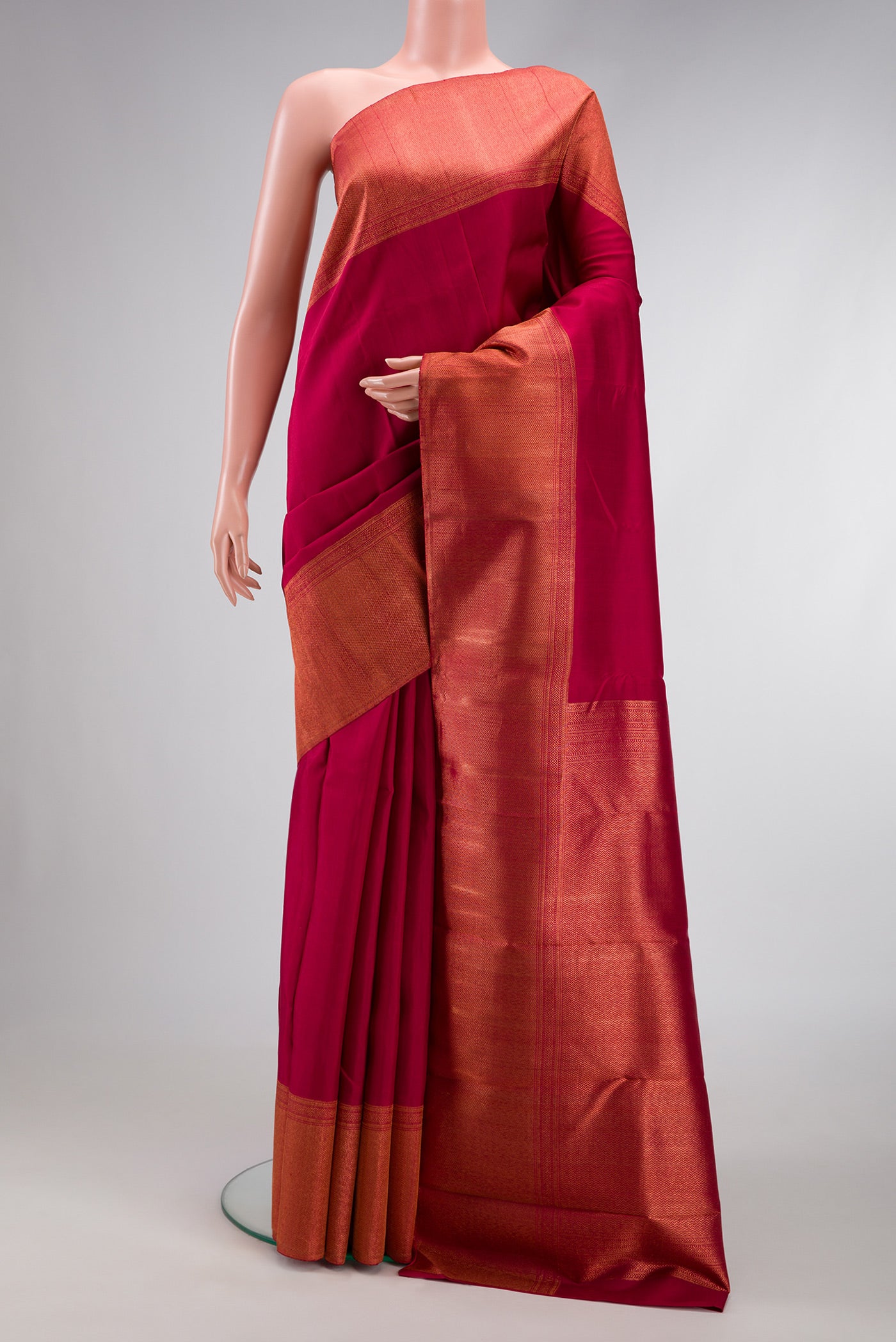 Maroon Dual Tone Kanjivaram Silk Saree with Plain Body and Zari Border.  displayed on a mannequin