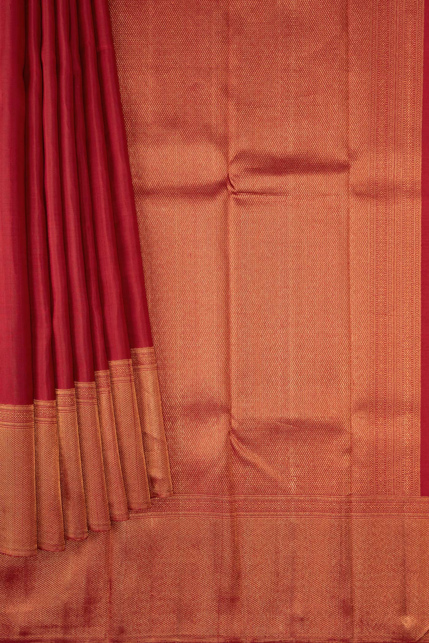 Pleats and pallu of Maroon Dual Tone Kanjivaram Silk Saree with Plain Body and Zari Border. 
