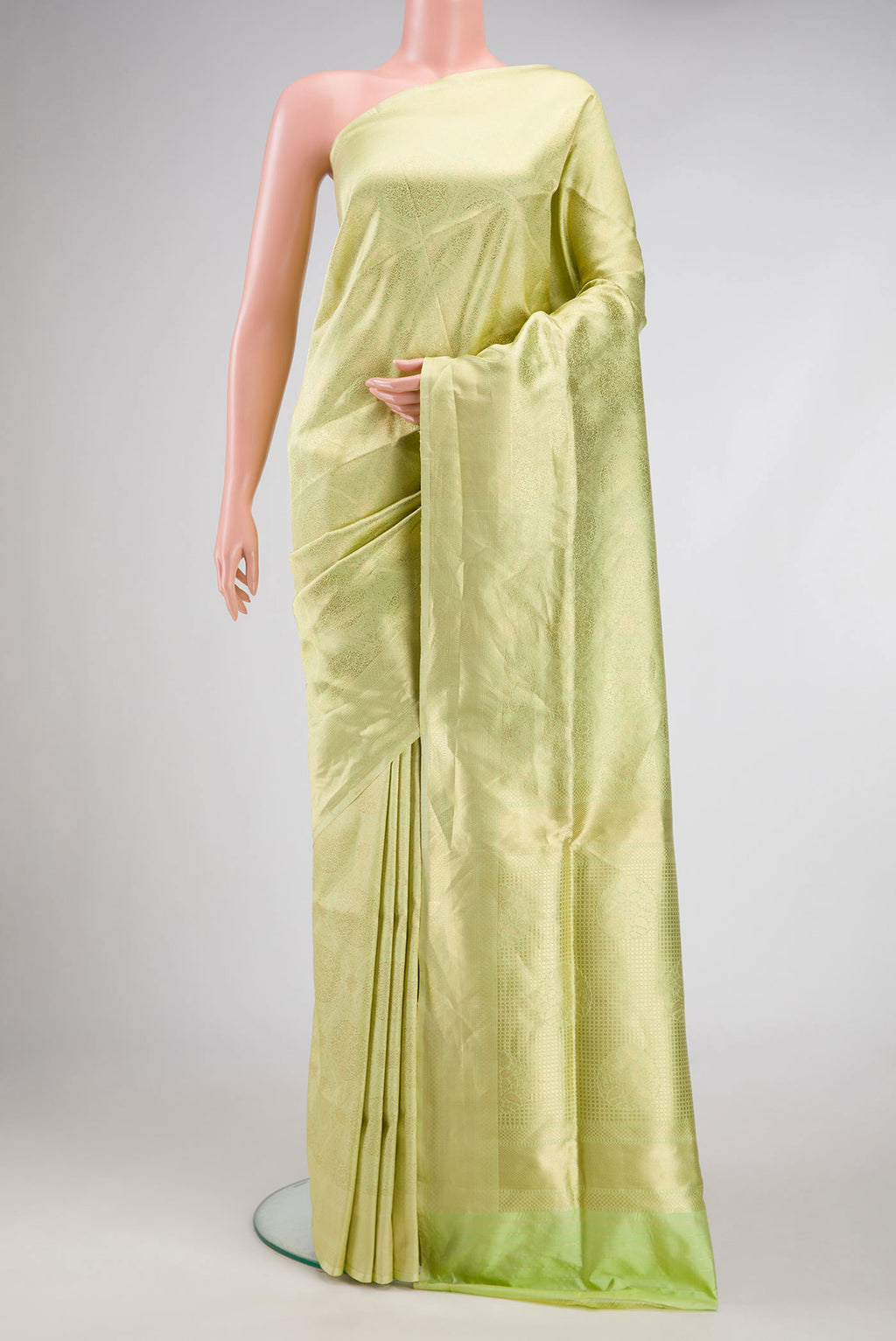 Pista Green Dual Tone Banarasi Silk Saree with Zari Brocade on the body and Zari Border.  displayed on a mannequin