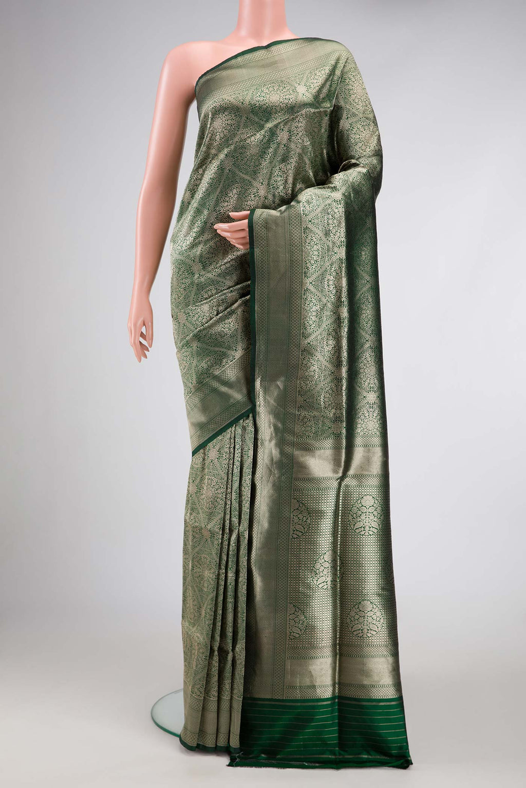 Bottle Green Dual Tone Banarasi Silk Saree with Zari Brocade on the body and Zari Border.  displayed on a mannequin
