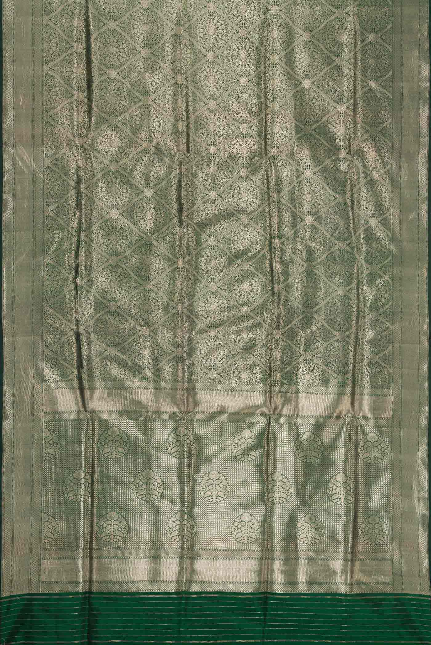 Flat view of Bottle Green Dual Tone Banarasi Silk Saree with Zari Brocade on the body and Zari Border. 