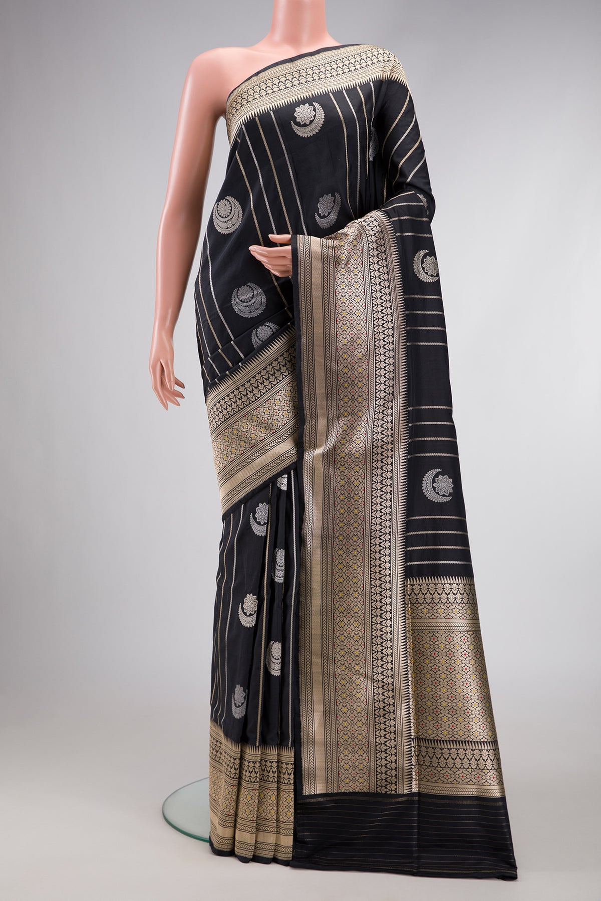 Black Dual Tone Banarasi Silk Saree with Zari Butta on the body and Zari Border.  displayed on a mannequin