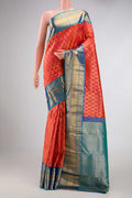 Brick Orange Dual Tone Kanchipuram Silk Saree with Zari Brocade on the body and Zari Border displayed on a mannequin