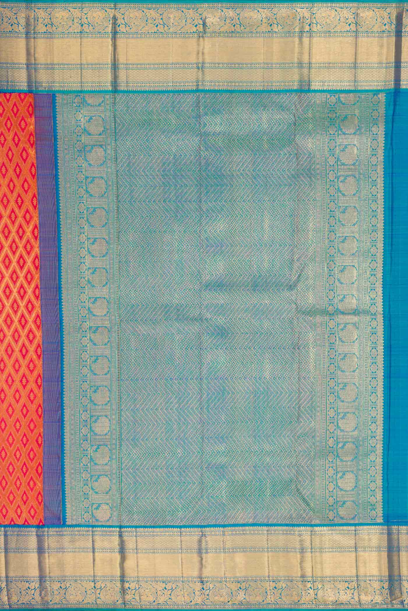 Close up image of the pallu of Brick Orange Dual Tone Kanchipuram Silk Saree with Zari Brocade on the body and Zari Border