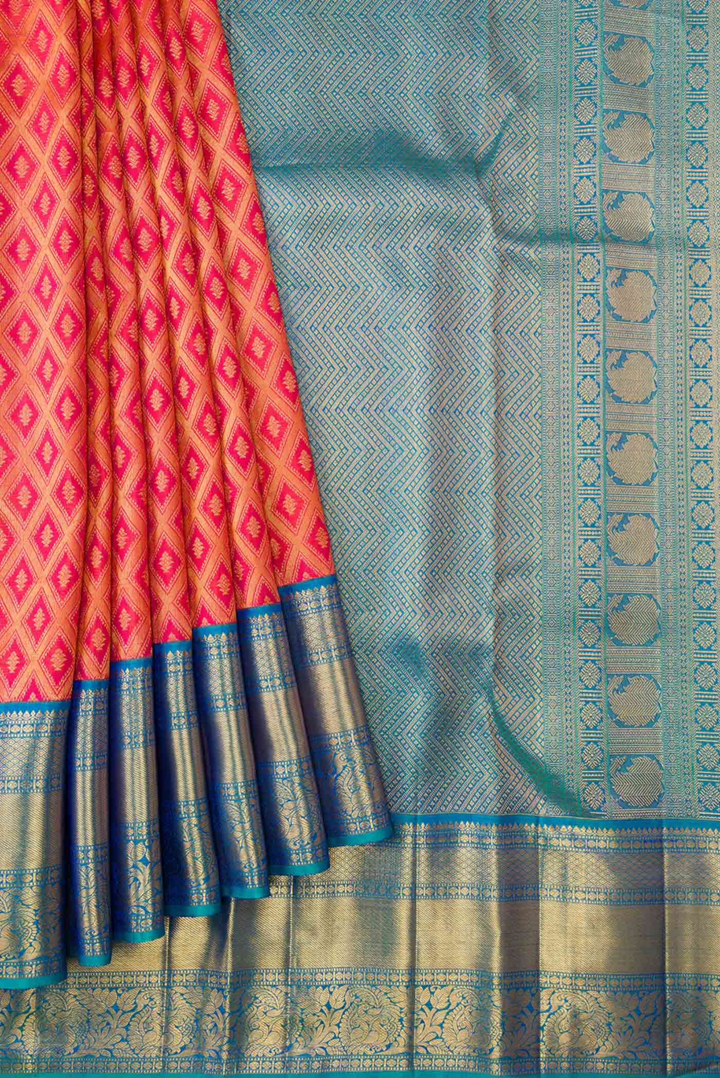 Pleats and pallu of Brick Orange Dual Tone Kanchipuram Silk Saree with Zari Brocade on the body and Zari Border
