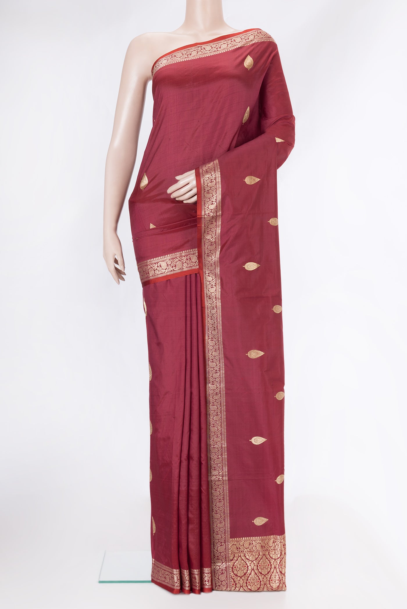 Maroon Dual Tone Banarasi Silk Saree with Zari Butta on the body and Zari Border.  displayed on a mannequin
