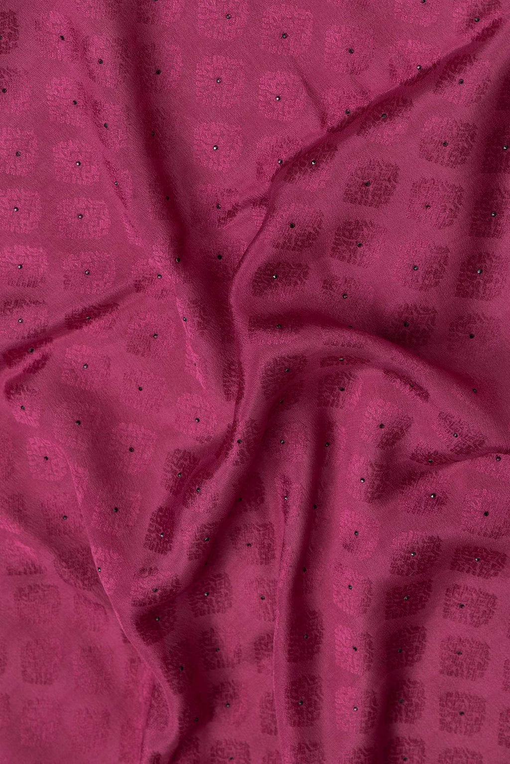 Close up of Magenta Dual Tone Georgette Saree with Jacquard design on the body and Zari Border.  displaying folds