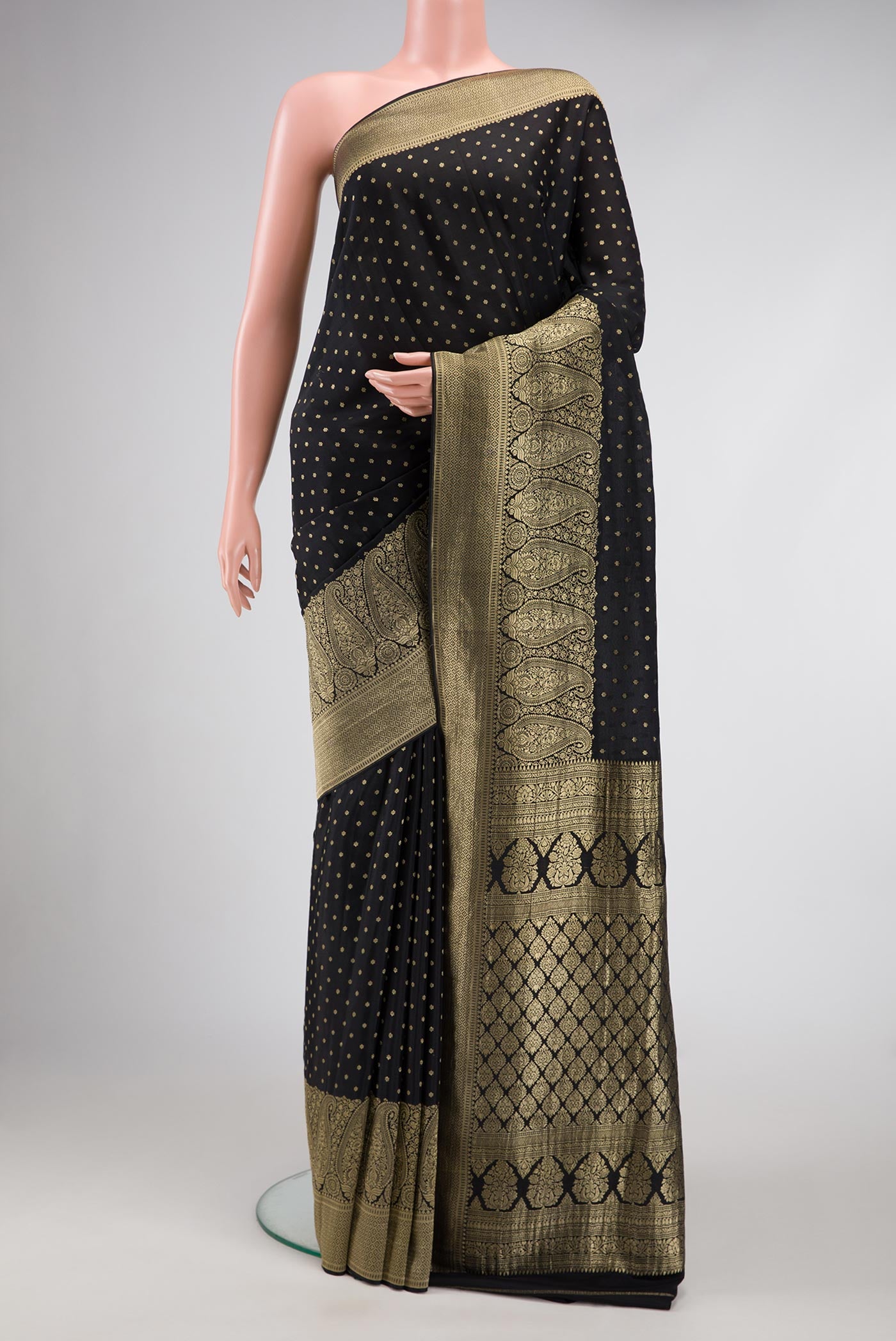 Black Dual Tone Mysore Crepe Saree with Zari Butta on the body and Fancy Border.  displayed on a mannequin