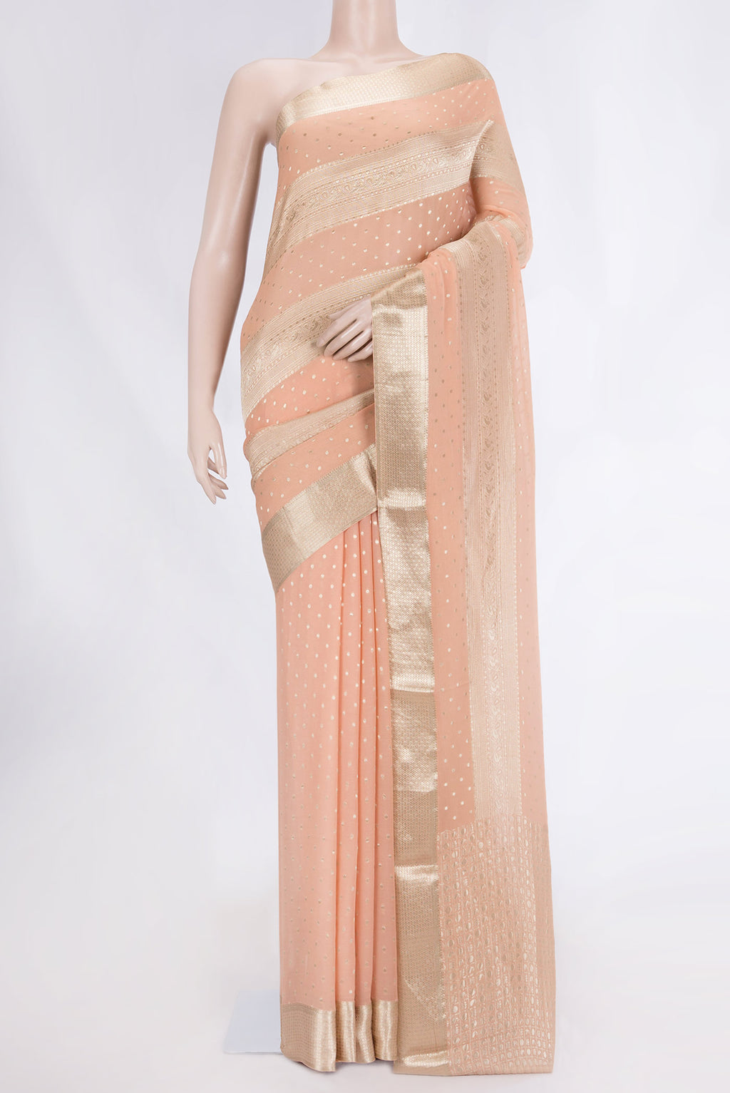 Golden Peach Dual Tone Mysore Georgette Saree with Zari Butta on the body and Zari Border displayed on a mannequin