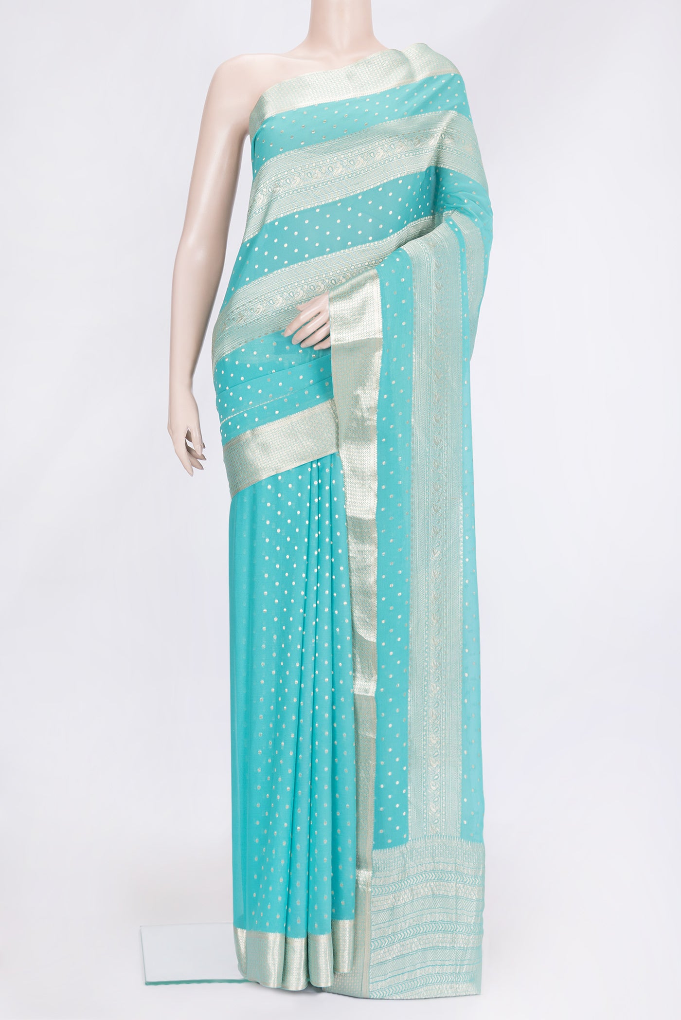 Sky Blue Dual Tone Banarasi Georgette Saree with Zari Brocade on the body and Zari Border.  displayed on a mannequin