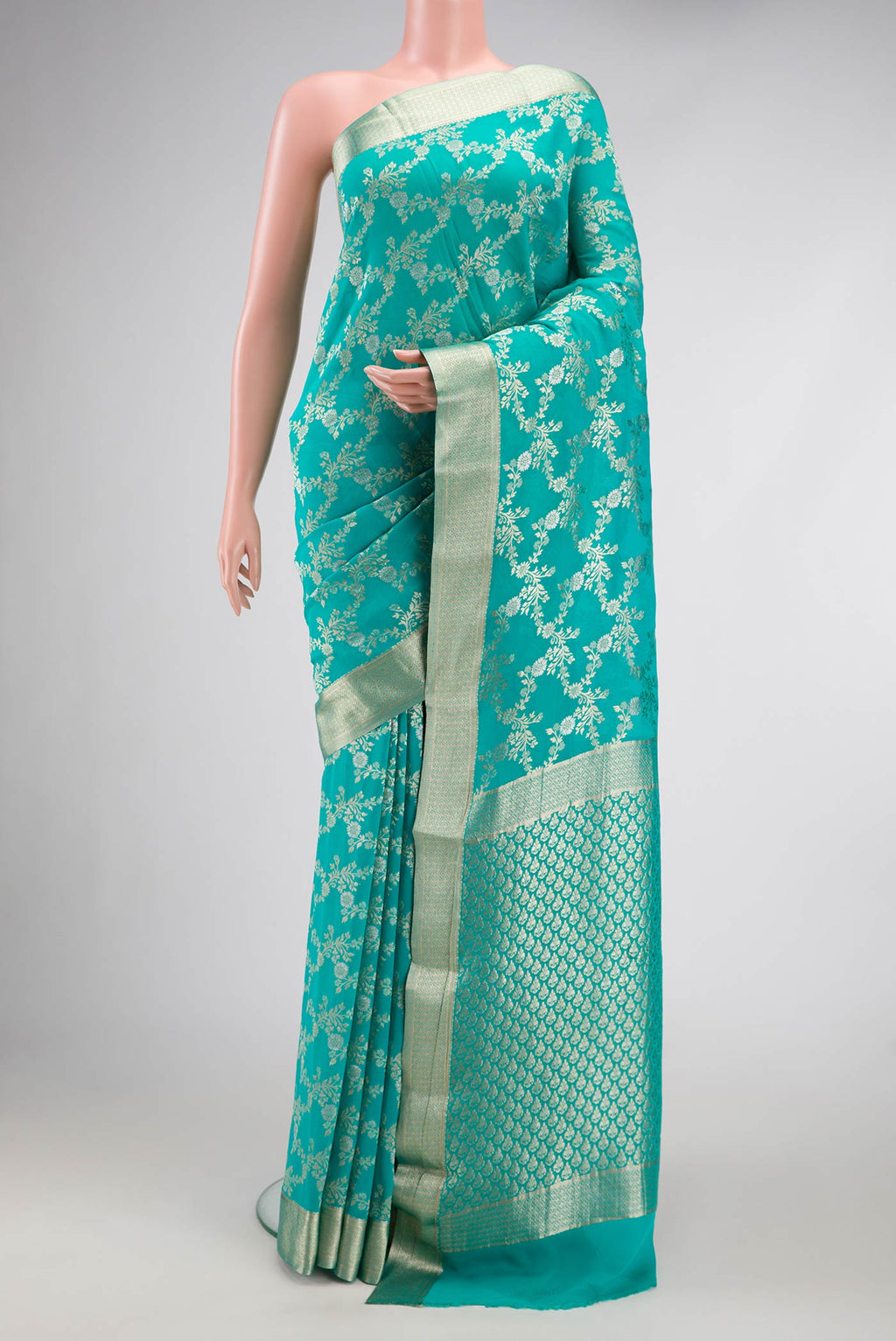 Sky Blue Dual Tone Banarasi Georgette Saree with Zari Brocade on the body and Zari Border.  displayed on a mannequin