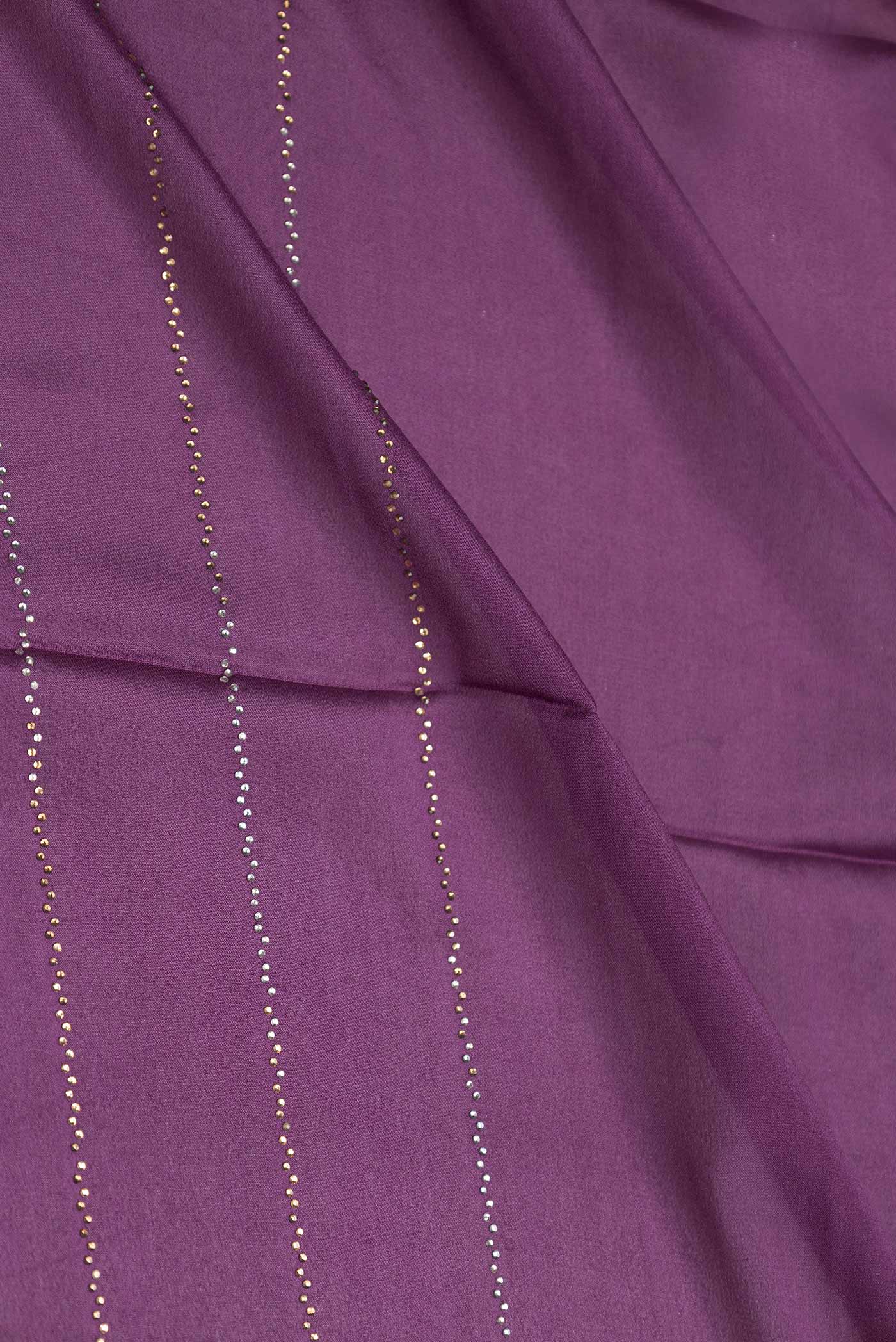 Close up of Burgundy Dual Tone Mysore Crepe Saree with Embroidery on the body and Zari Border displaying folds