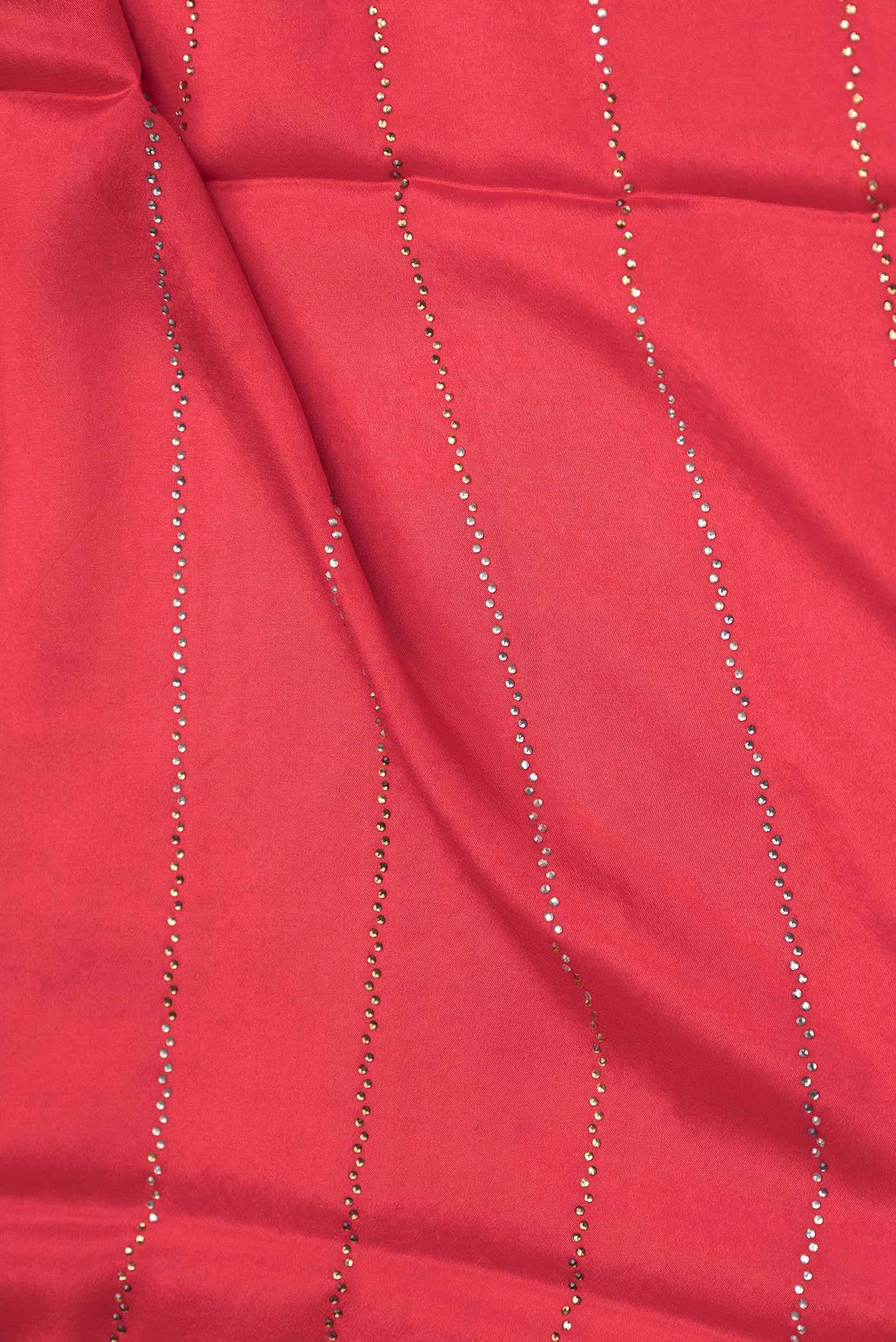 Close up of Red Dual Tone Mysore Crepe Saree with Embroidery on the body and Zari Border displaying folds