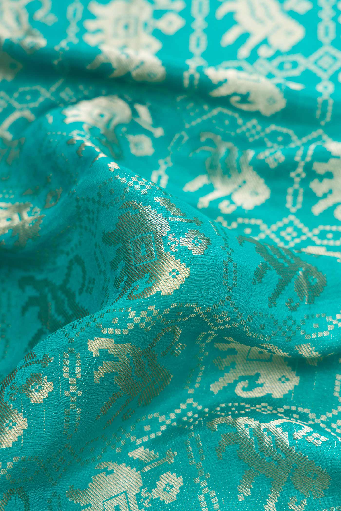 Close up of Sky Blue Dual Tone Banarasi Georgette Saree with Zari Brocade on the body and Zari Border.  displaying folds
