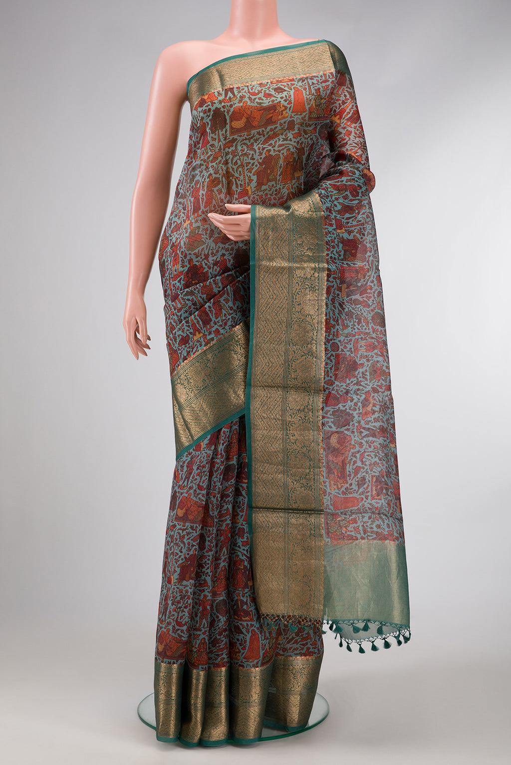 Light Green Dual Tone Organza Silk Saree with Printed design on the body and Zari Border.  displayed on a mannequin