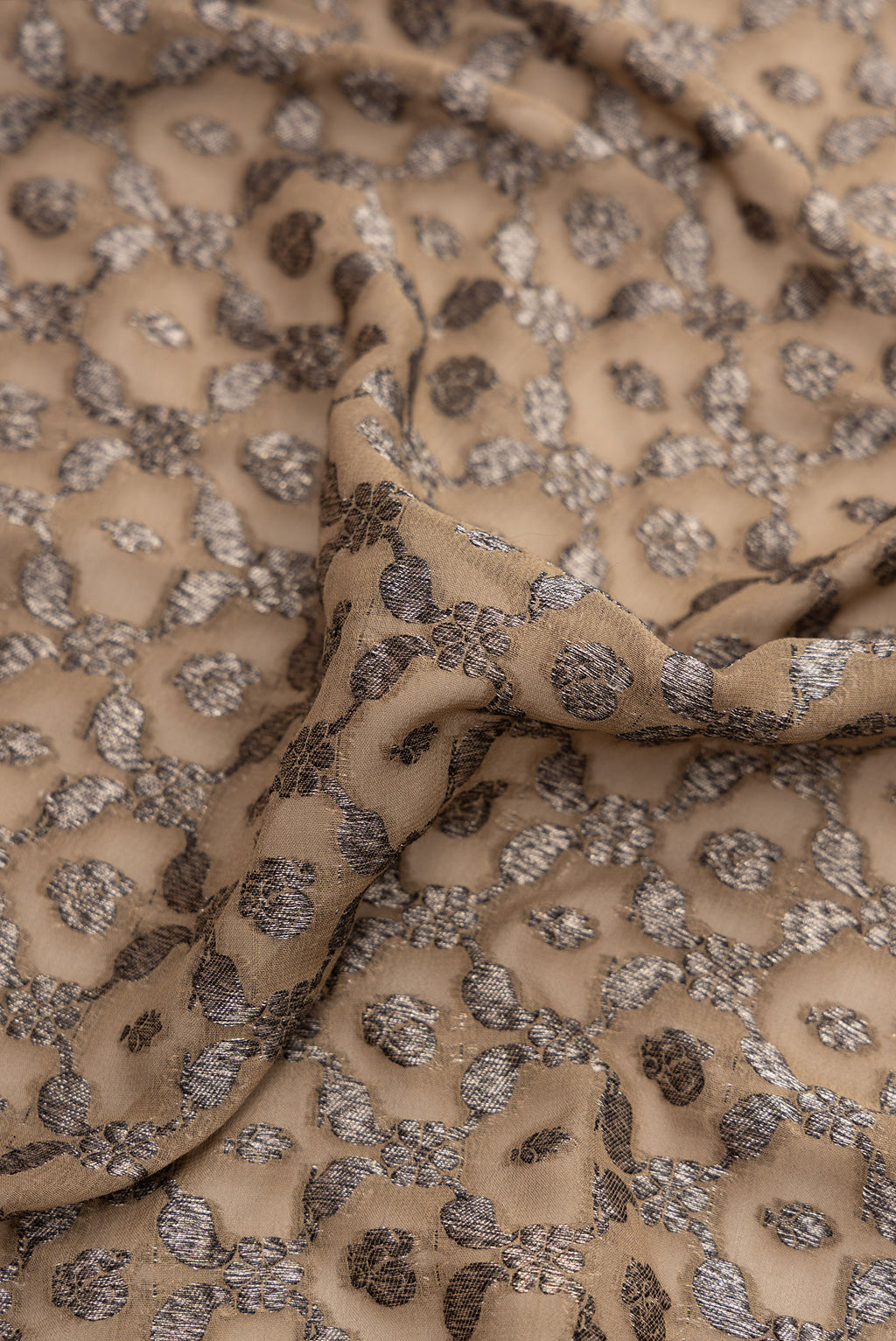 Close up of Rani Pink Double Ikat Saree with Ikat Print on the body and Ikat Border.  displaying folds