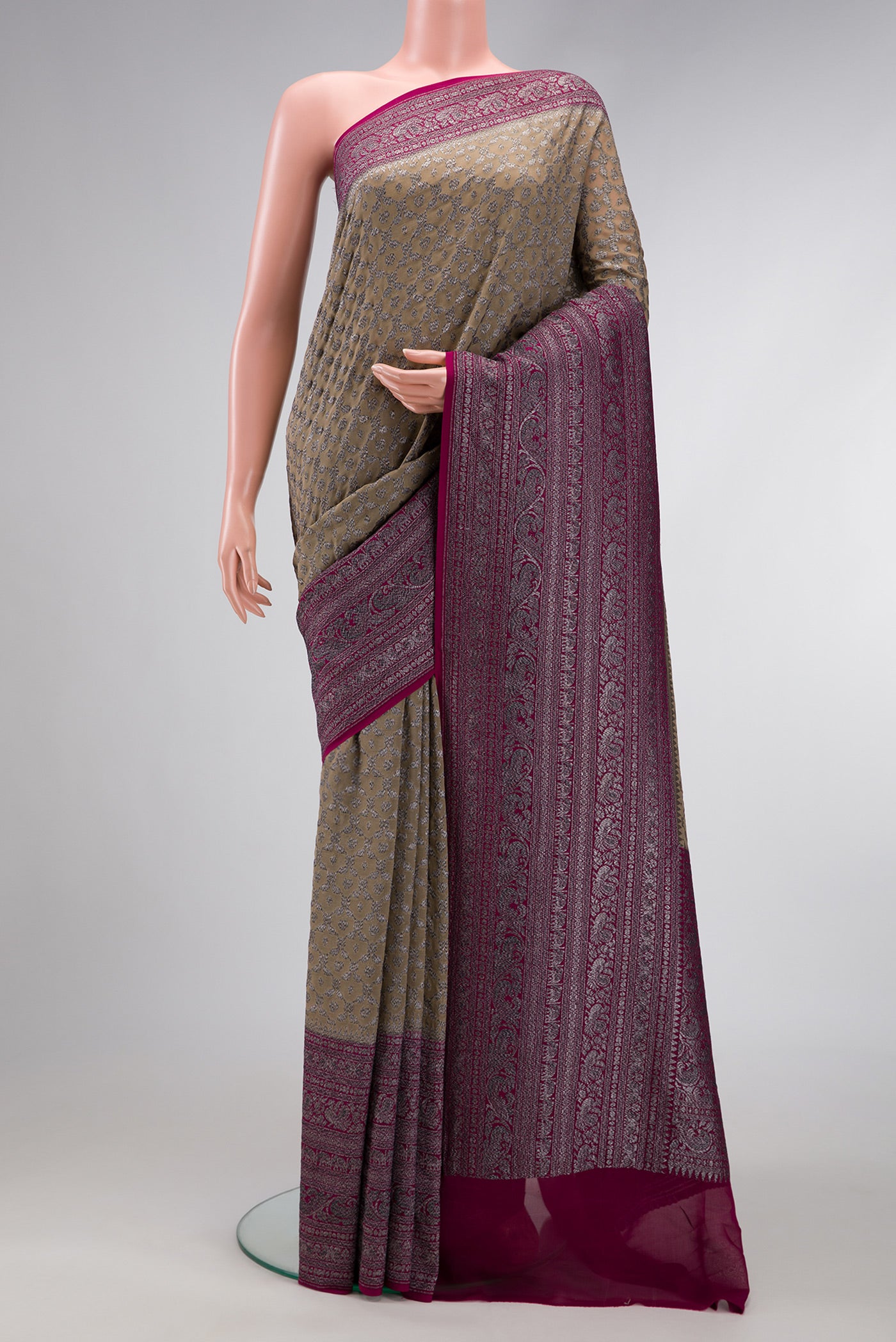 Rani Pink Double Ikat Saree with Ikat Print on the body and Ikat Border.  displayed on a mannequin