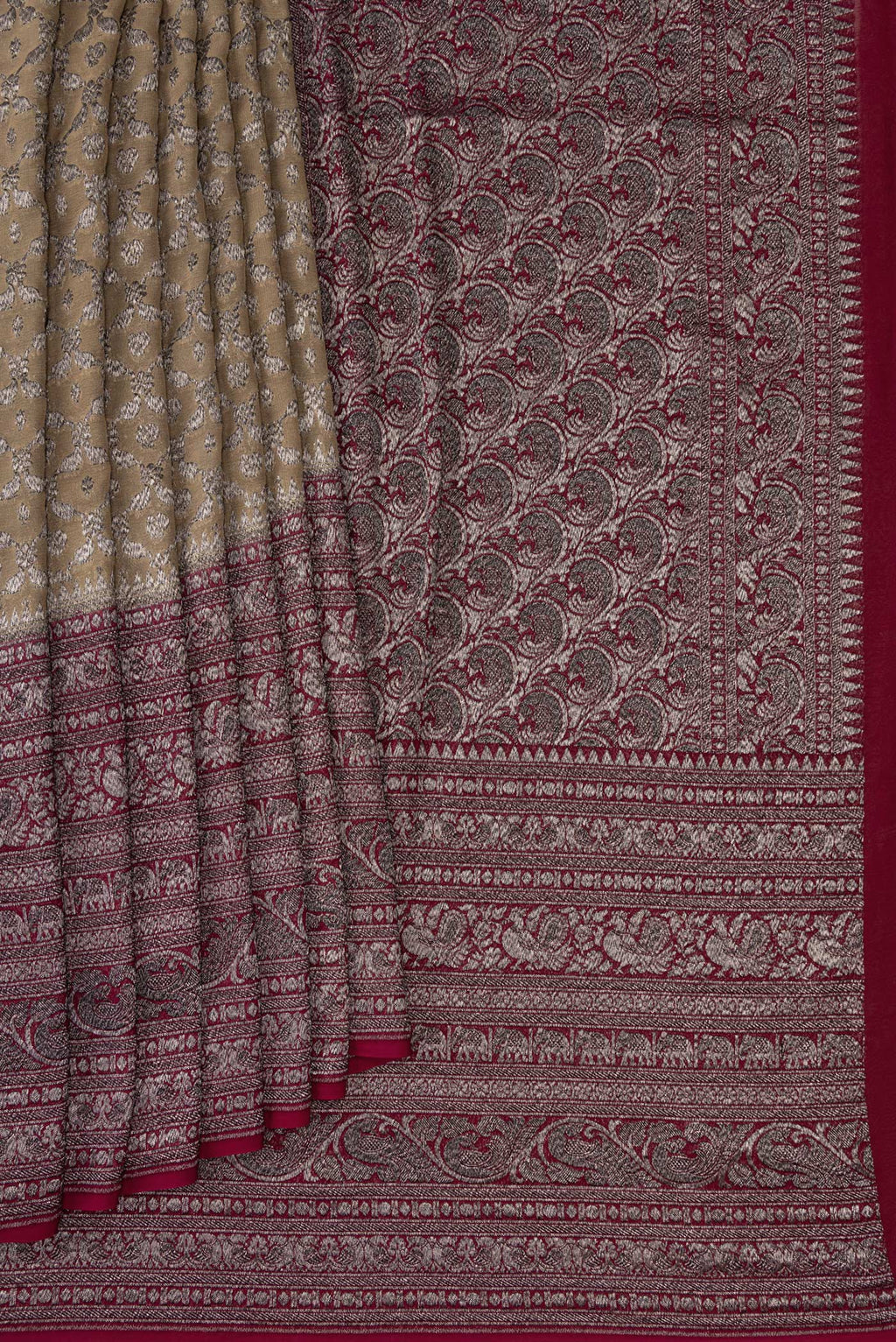 Pleats and pallu of Rani Pink Double Ikat Saree with Ikat Print on the body and Ikat Border. 
