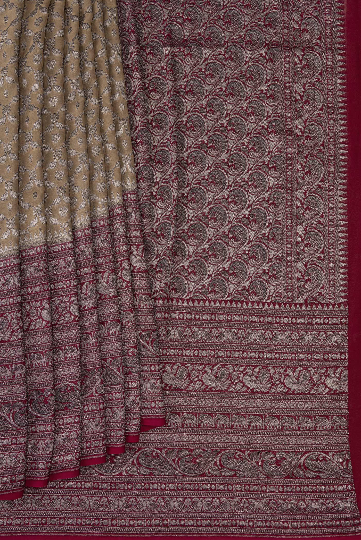 Pleats and pallu of Rani Pink Double Ikat Saree with Ikat Print on the body and Ikat Border. 