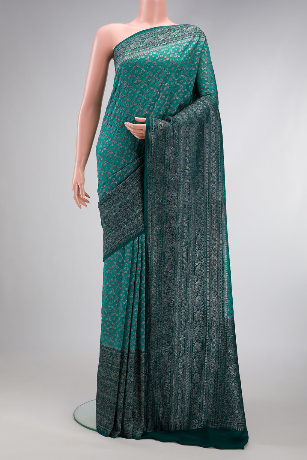 Green Dual Tone Mysore Georgette Saree with Zari Brocade on the body and Zari Border.  displayed on a mannequin