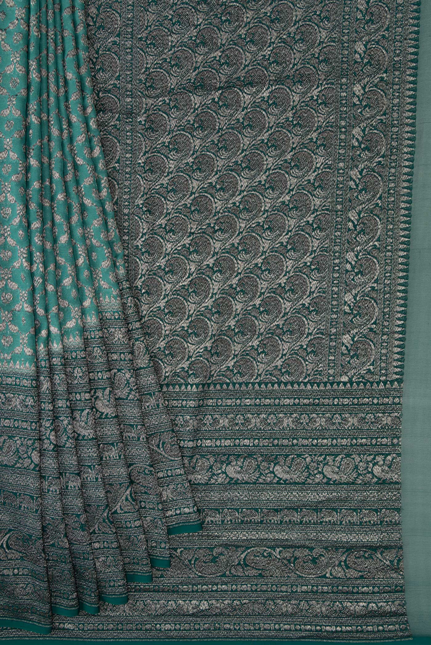 Pleats and pallu of Green Dual Tone Mysore Georgette Saree with Zari Brocade on the body and Zari Border. 