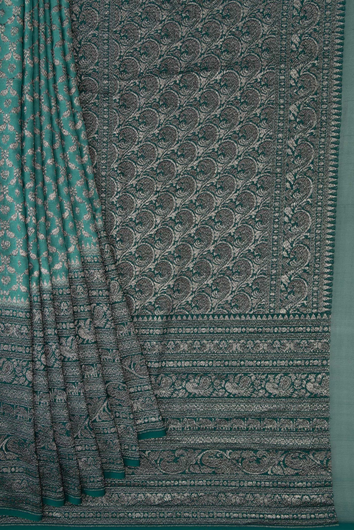 Pleats and pallu of Green Dual Tone Mysore Georgette Saree with Zari Brocade on the body and Zari Border. 