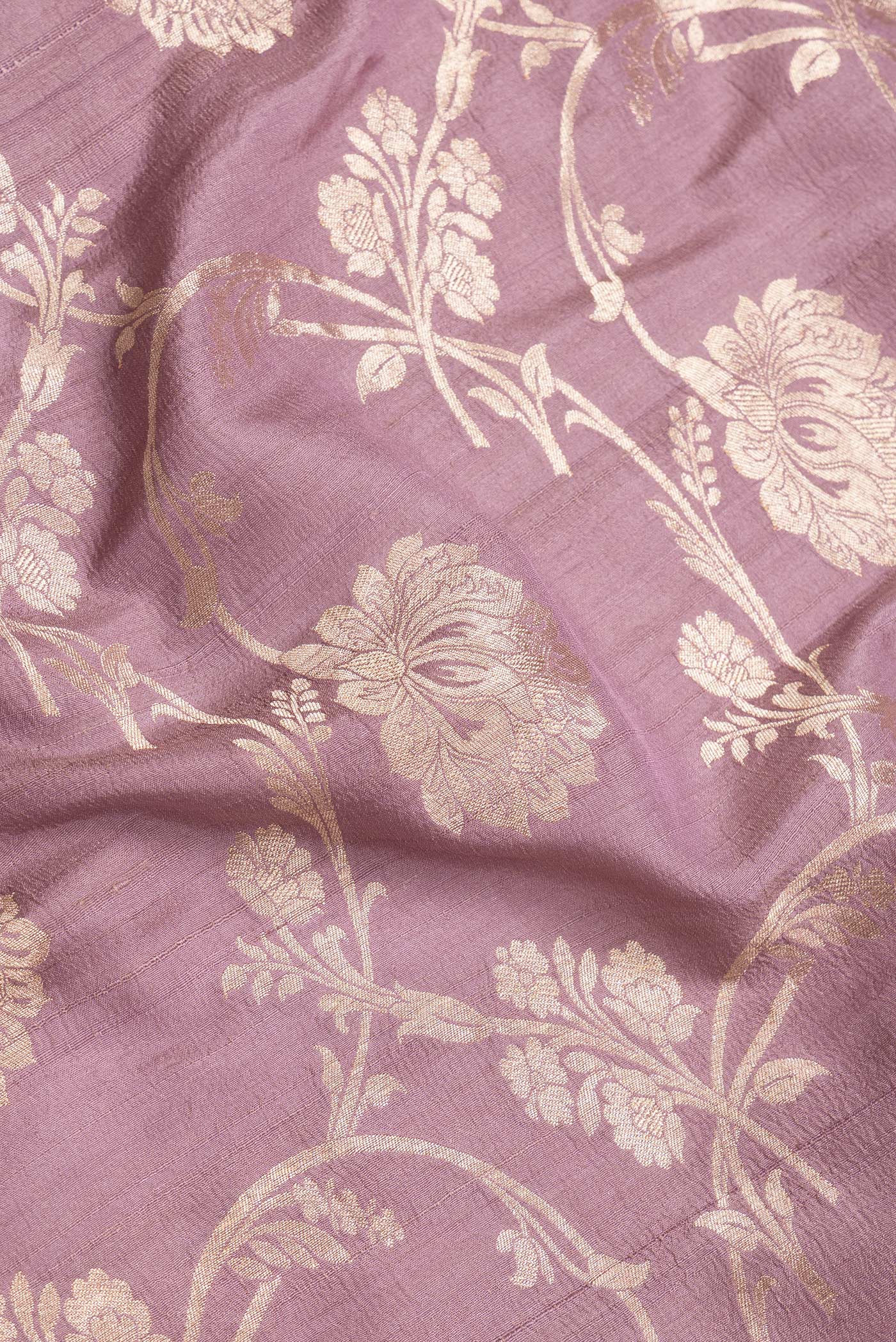 Close up of Pink Dual Tone Tussar Silk Saree with Zari Brocade on the body and Zari Border.  displaying folds