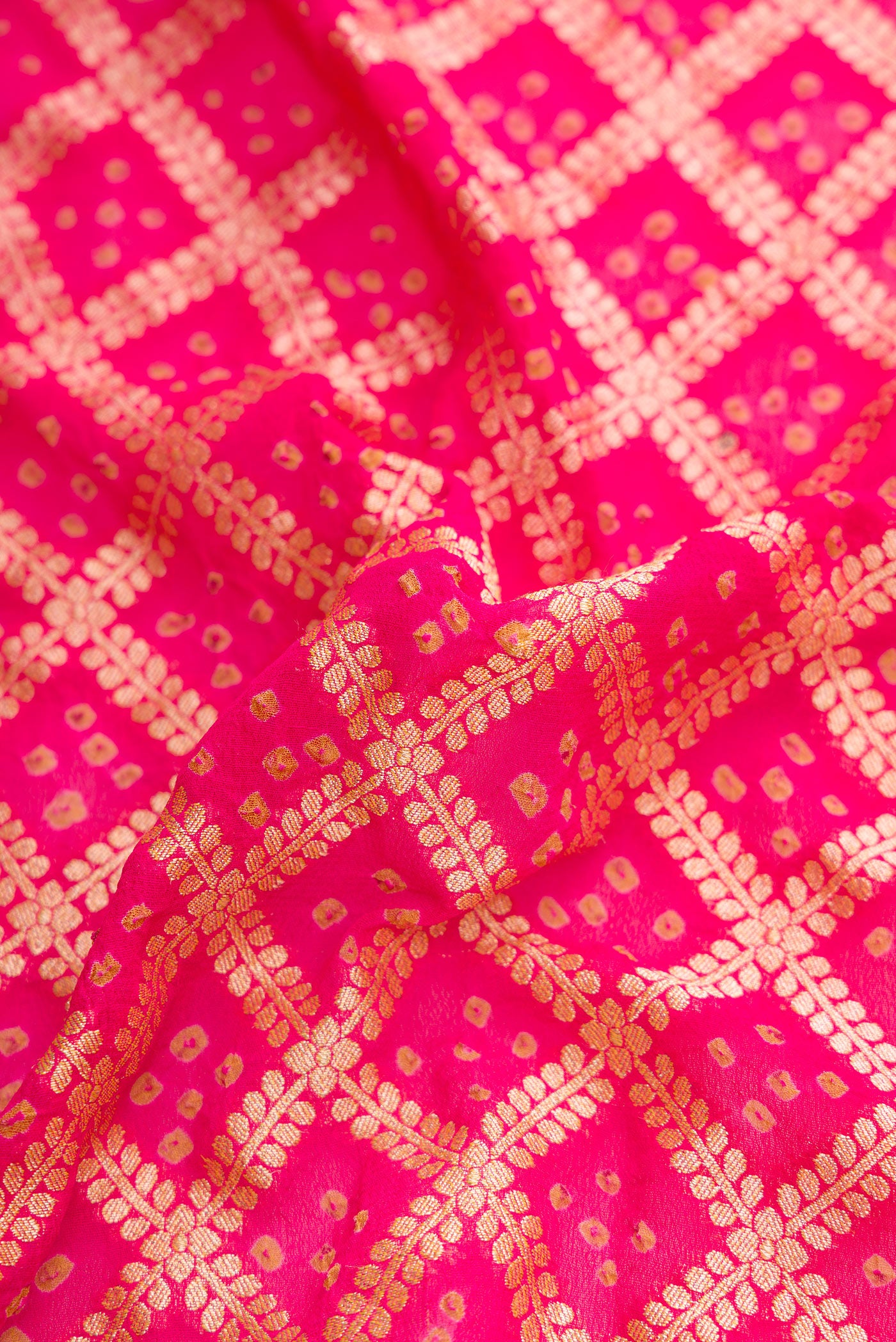 Close up of Pink Dual Tone Banarasi Georgette Saree with Zari Brocade on the body and Zari Border.  displaying folds