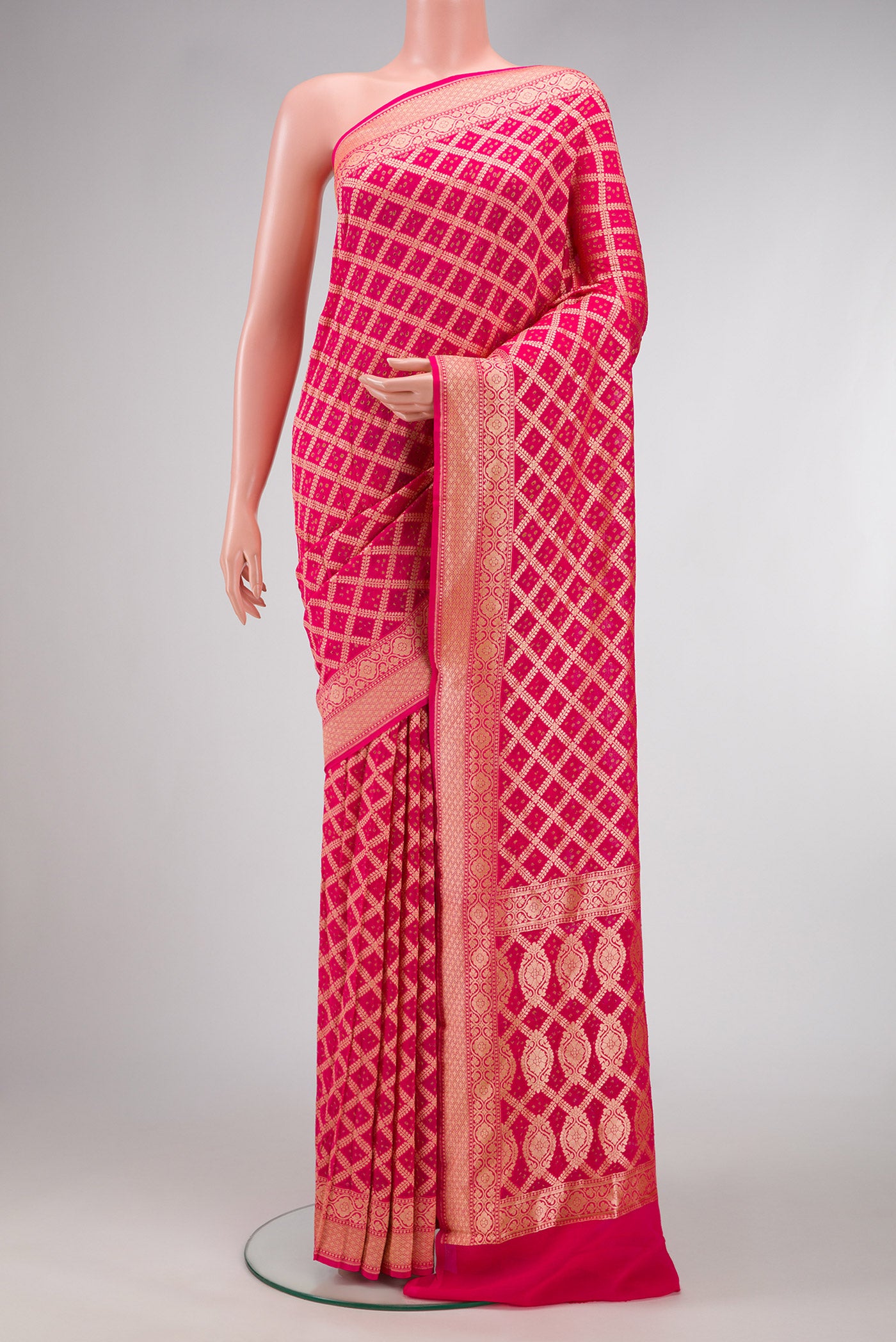 Pink Dual Tone Banarasi Georgette Saree with Zari Brocade on the body and Zari Border.  displayed on a mannequin