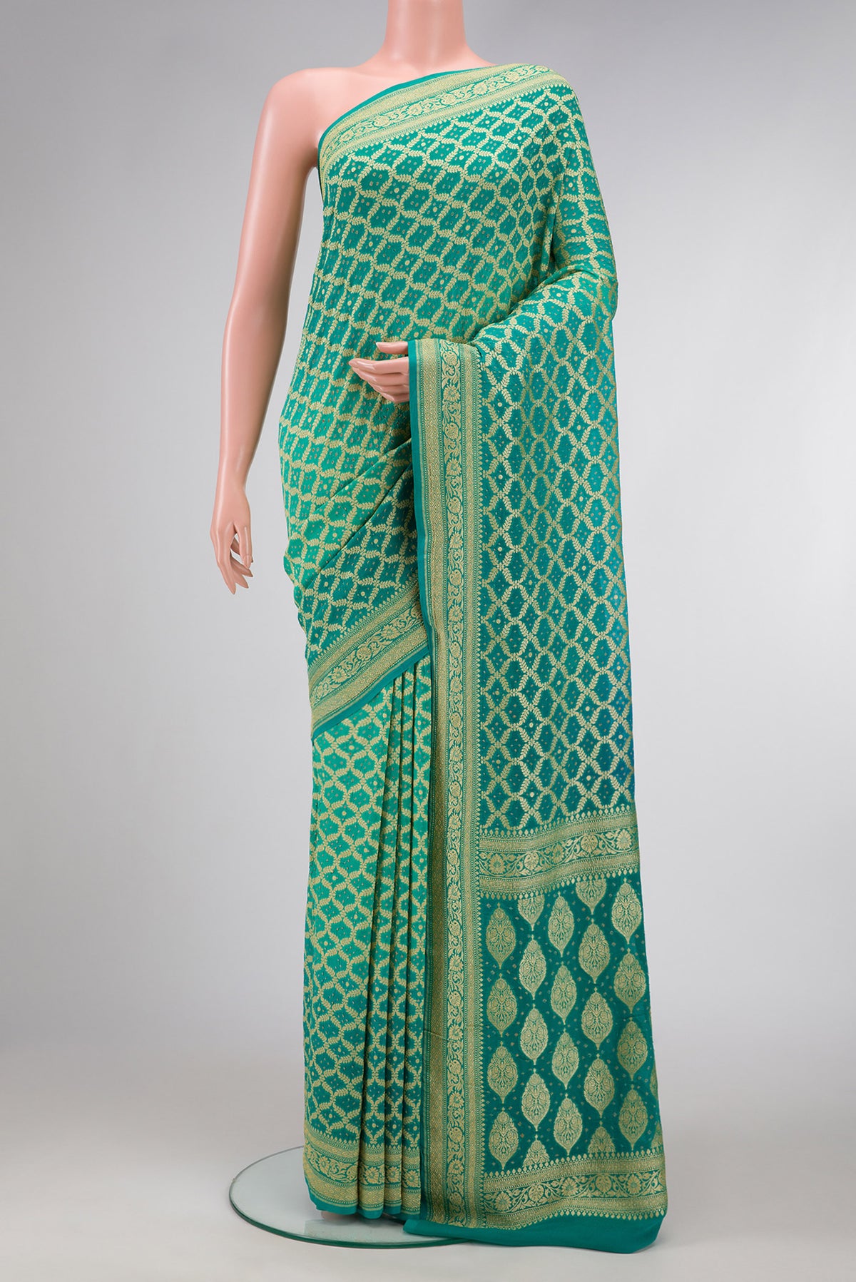 Sea Green Dual Tone Banarasi Georgette Saree with Zari Brocade on the body and Zari Border.  displayed on a mannequin