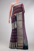 Burgundy Dual Tone Organza Silk Saree with Printed design on the body and Zari Border.  displayed on a mannequin