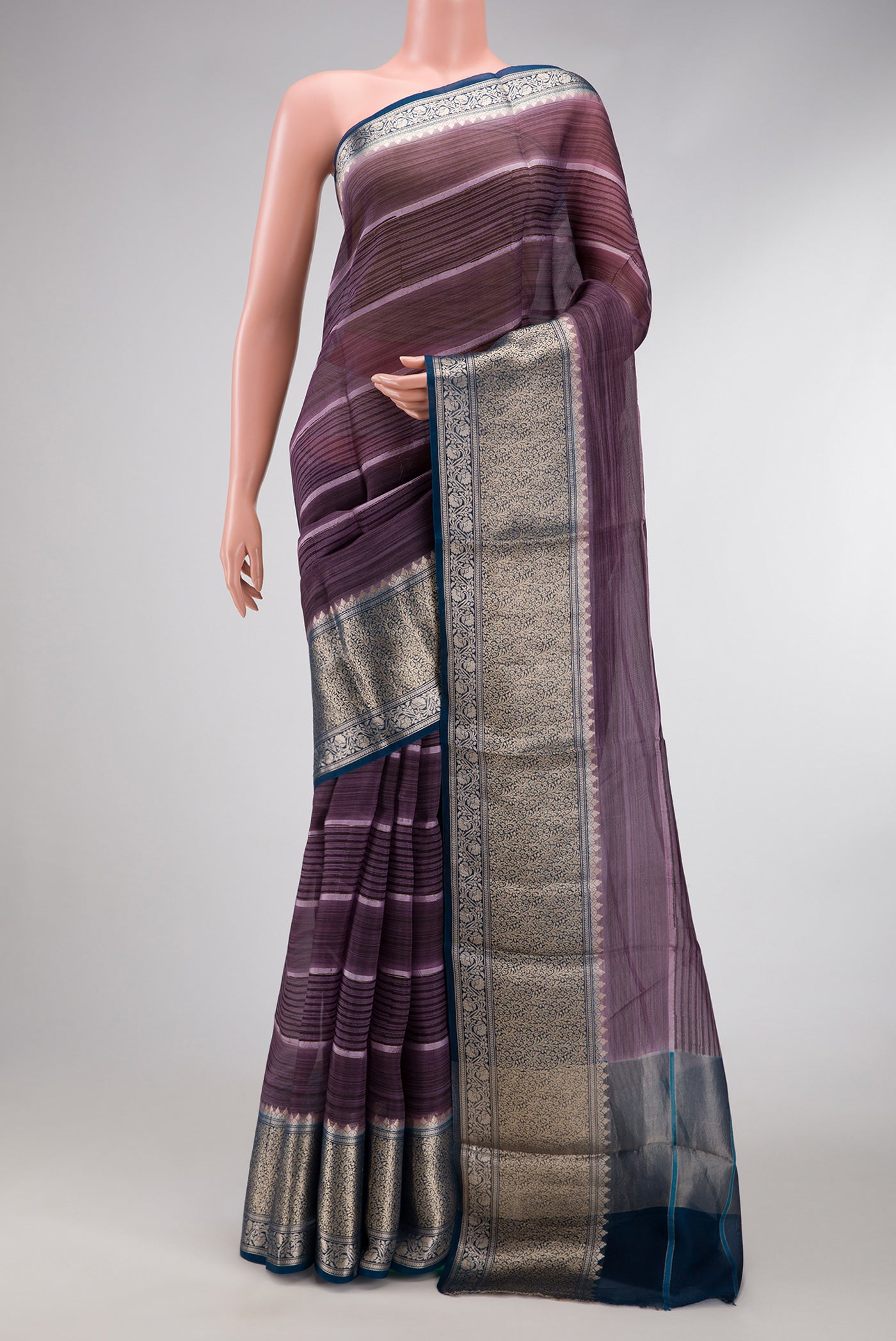 Burgundy Dual Tone Organza Silk Saree with Printed design on the body and Zari Border.  displayed on a mannequin