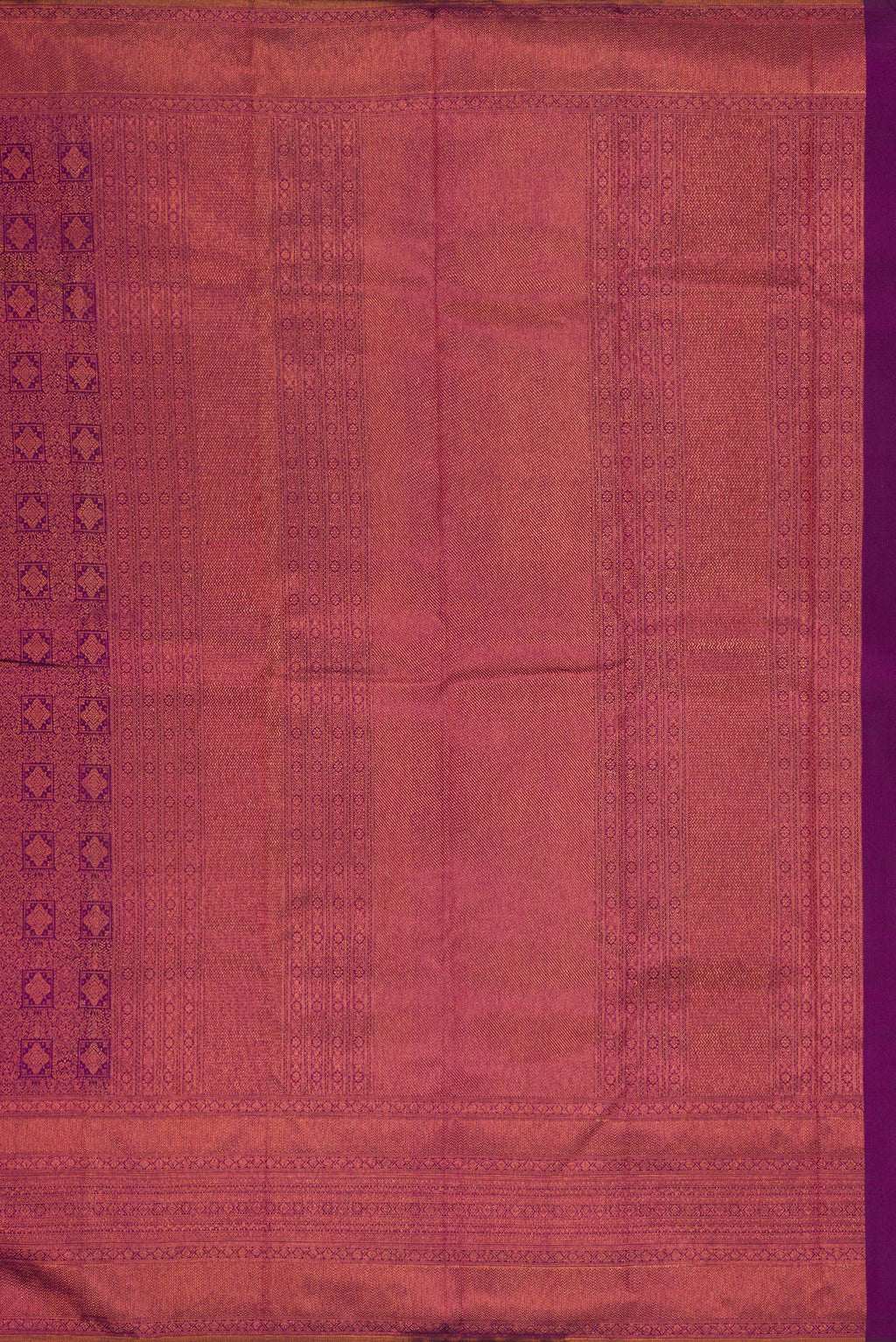 Close up image of the pallu of Purple Dual Tone Kanchipuram Silk Saree with Zari Brocade on the body and Fancy Border. 