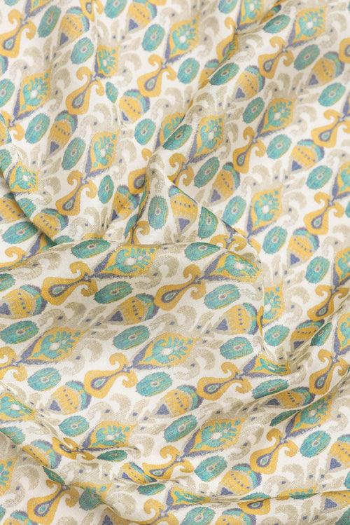 Close up of Beige Blended Crepe Saree with Printed design on the body and Printed Border.  displaying folds